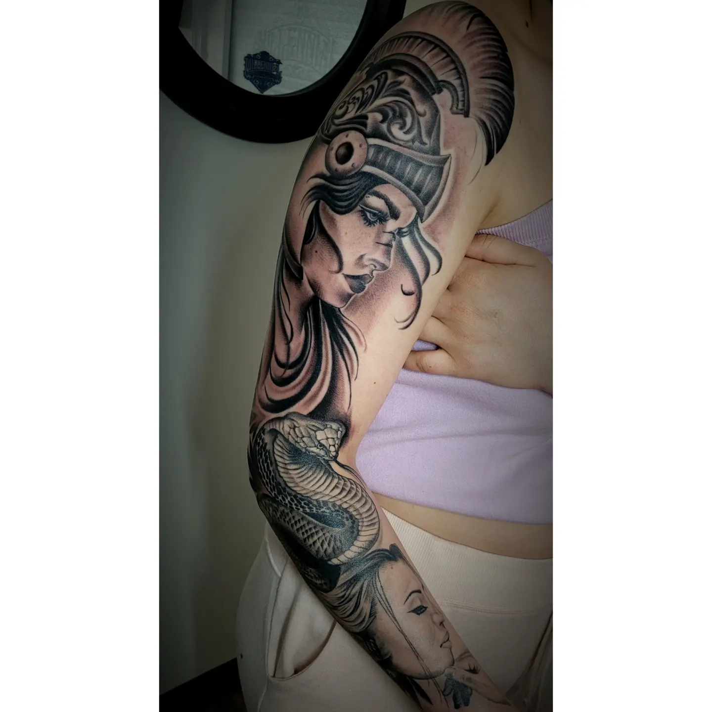 Woman with helmet realism tattoo on the upper arm by 🇲🇽Angelique Ortiz🇺🇲, Sugar Hill, Georgia