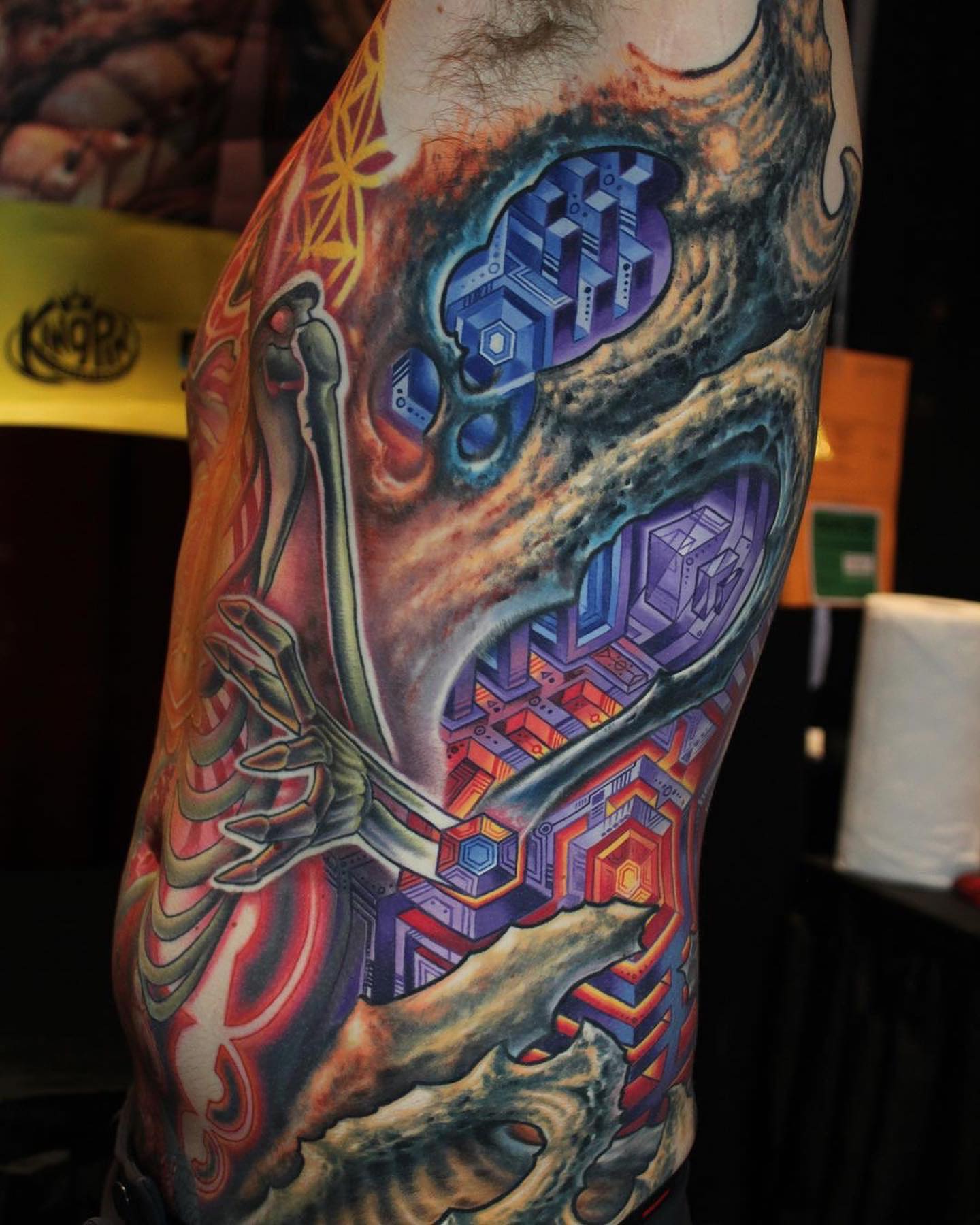 Abstract geometric structure geometric tattoo on the upper arm by Mike Cole
