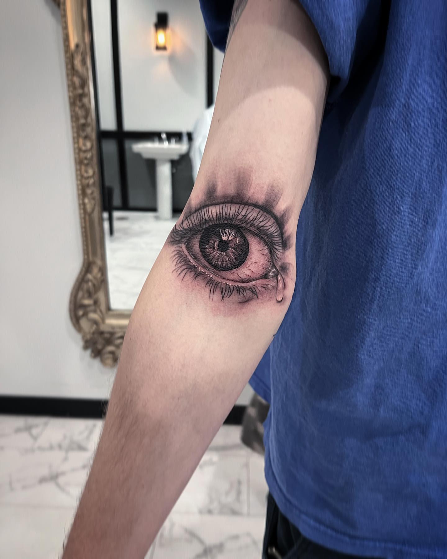 Eye realism tattoo on the forearm by Mia