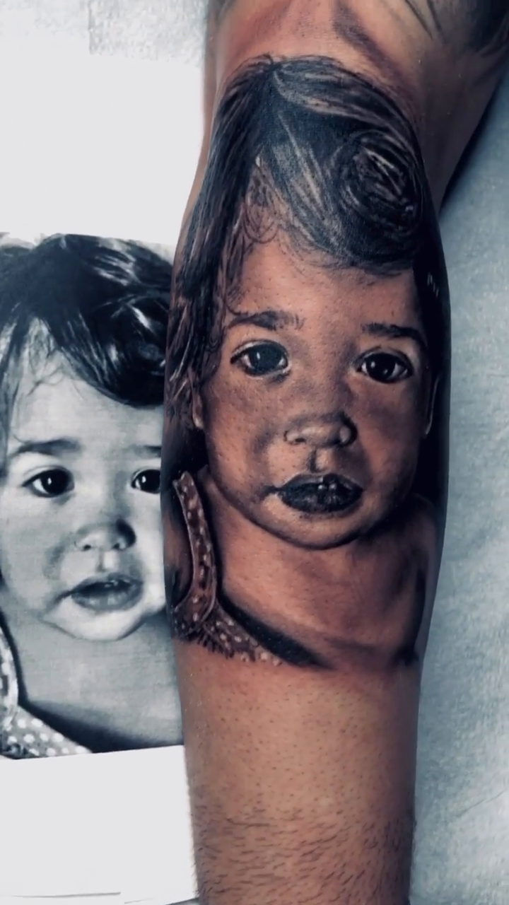 Portrait of two children realism tattoo by Nelson Tellez