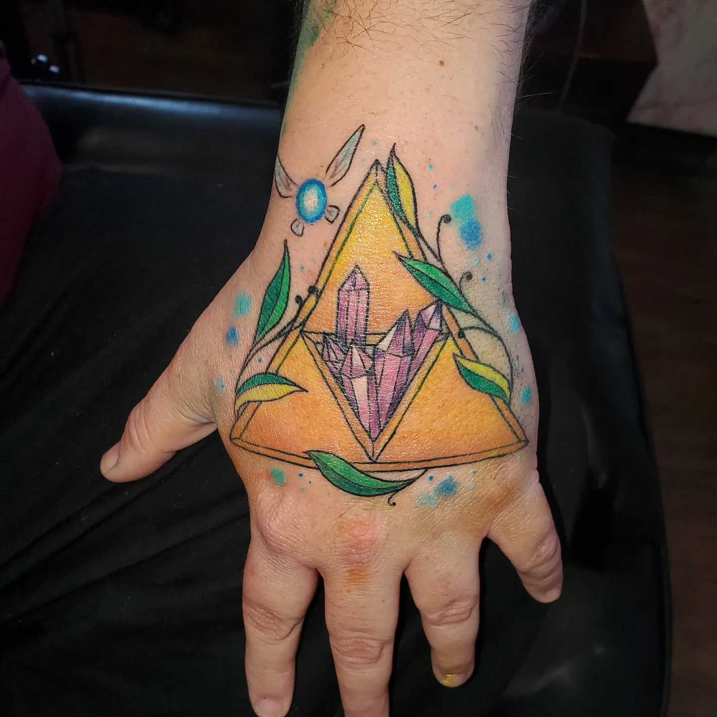 Tattoo by @haileysharpstabs — geometric, watercolor