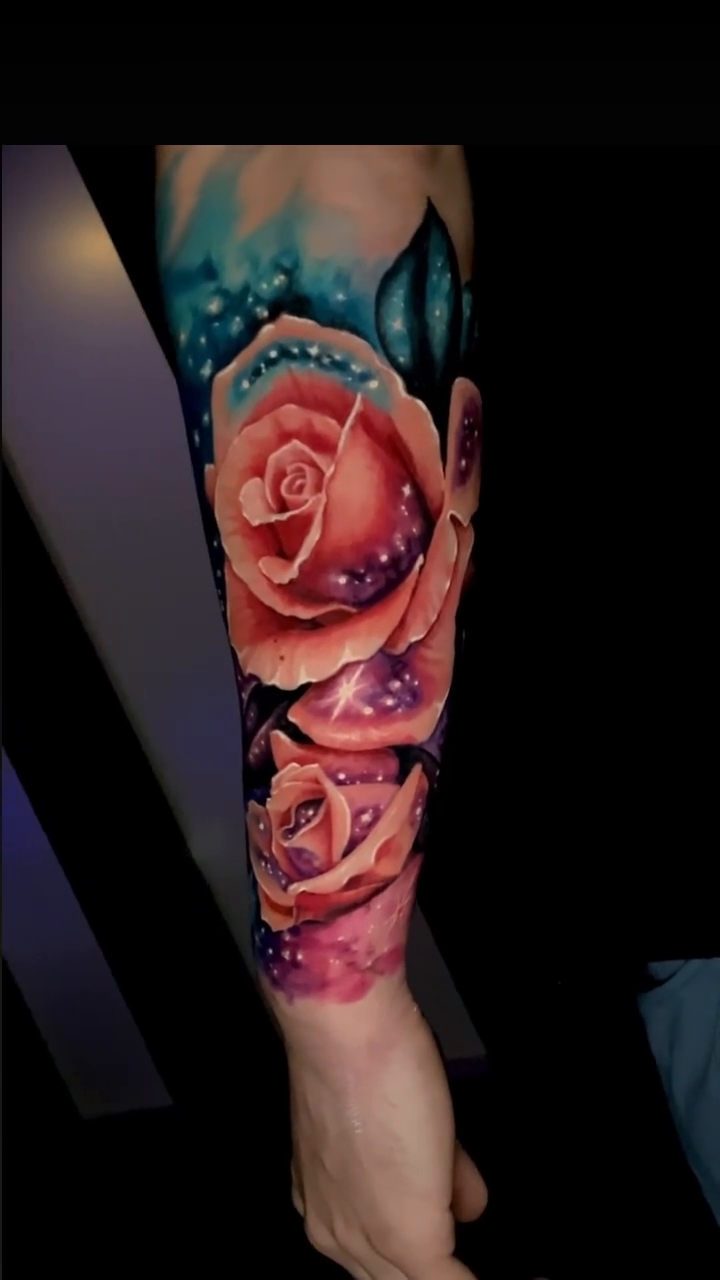 Roses and cosmic background realism tattoo by Sean Flood