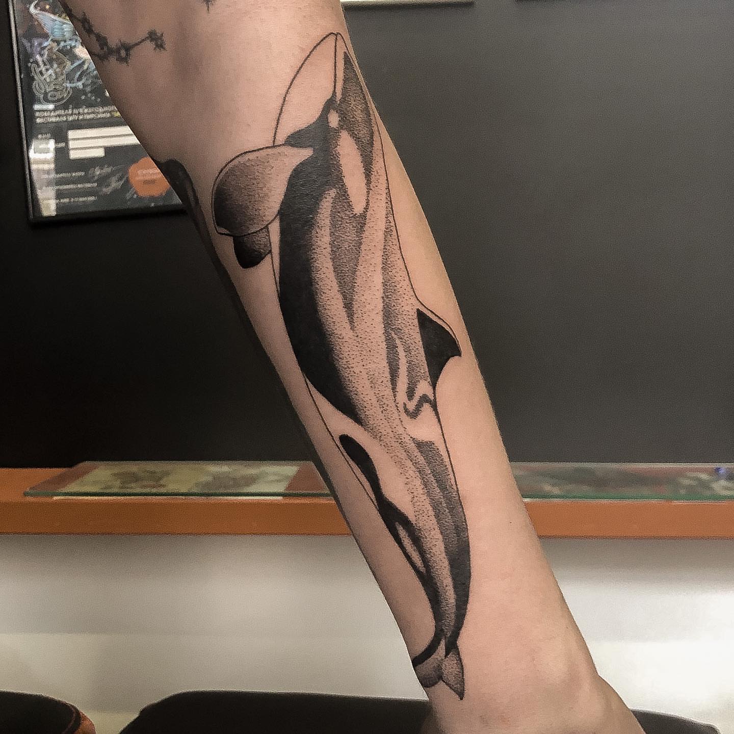 Orca whale dotwork tattoo on the forearm by NYC