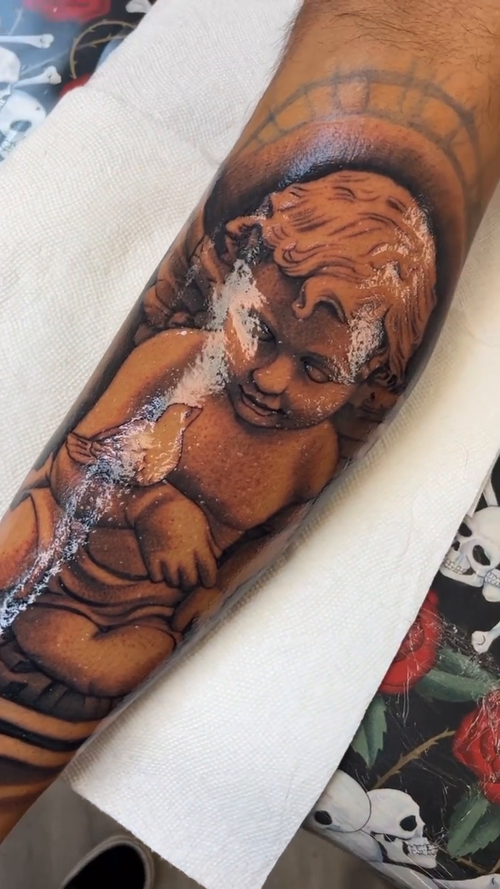Cherub with dove realism tattoo by Joseph Alvarado