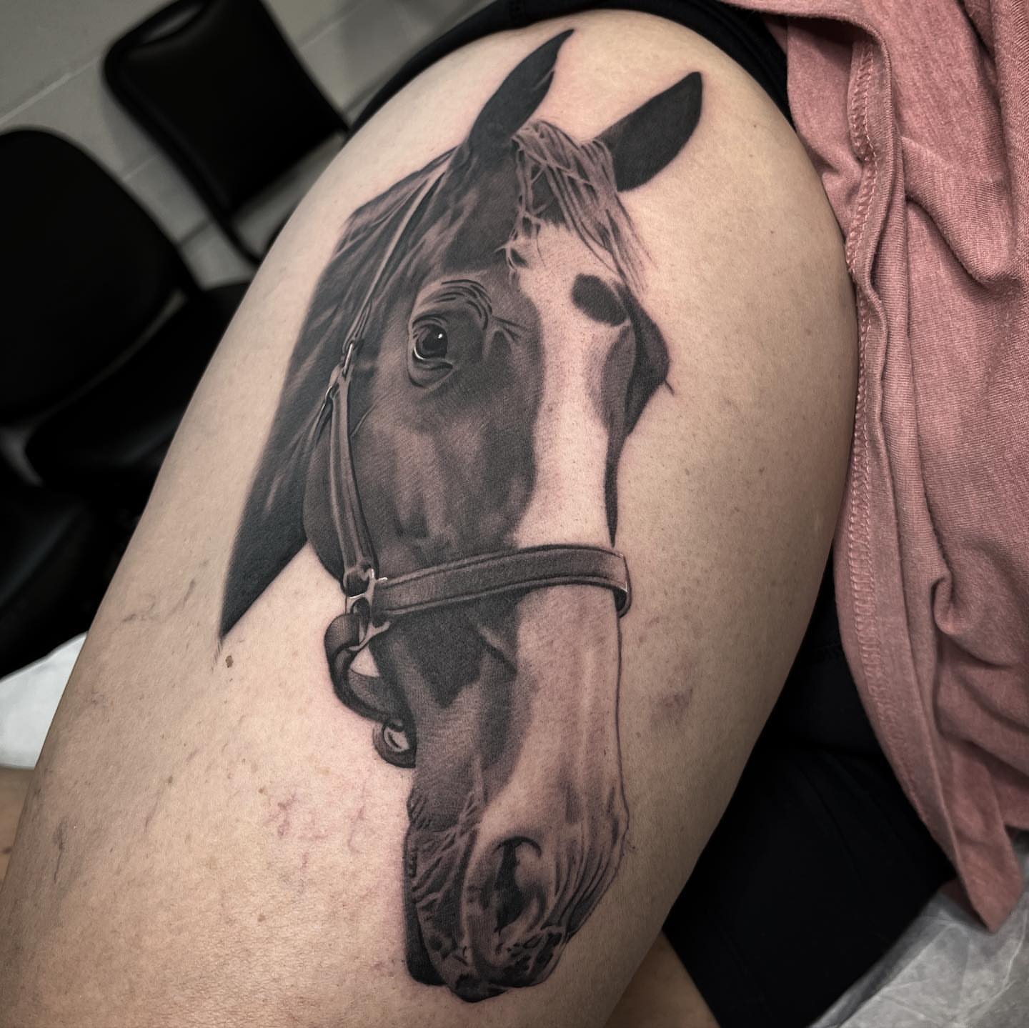 Horse head realism tattoo on the thigh by Bradley Dozier