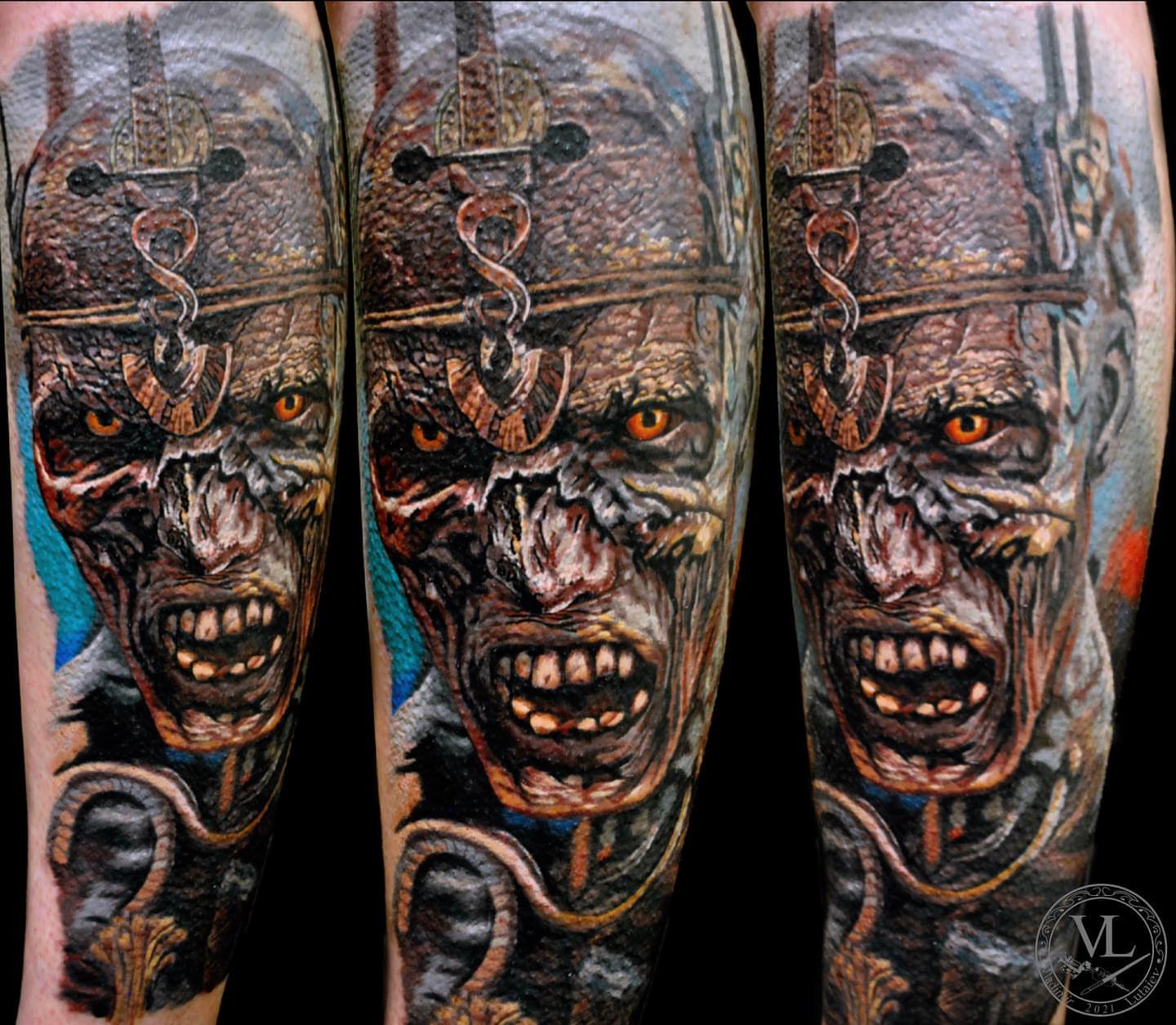 Viking warrior realism tattoo on the forearm by Vladimir Lutaev
