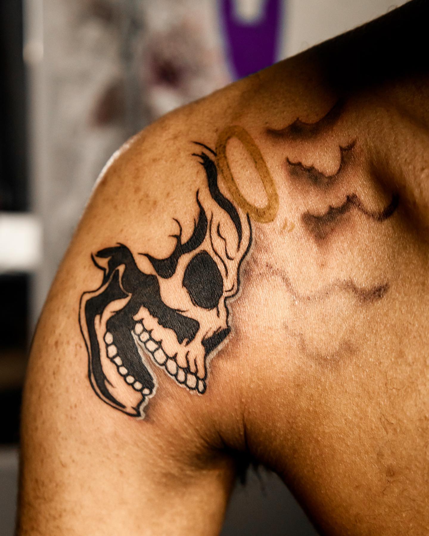 Skull American traditional tattoo on the shoulder by Traveling Tattoo Artist π