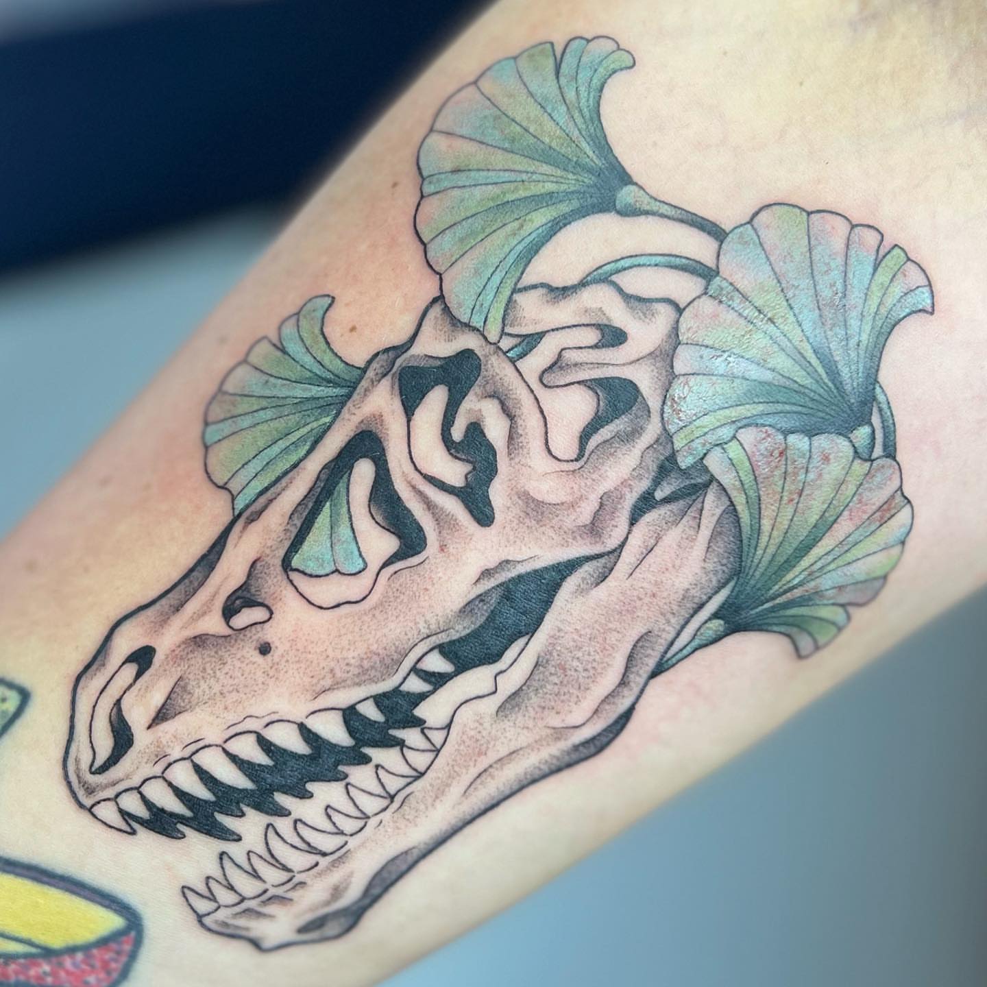 Dinosaur skull realism tattoo on the forearm by Blu