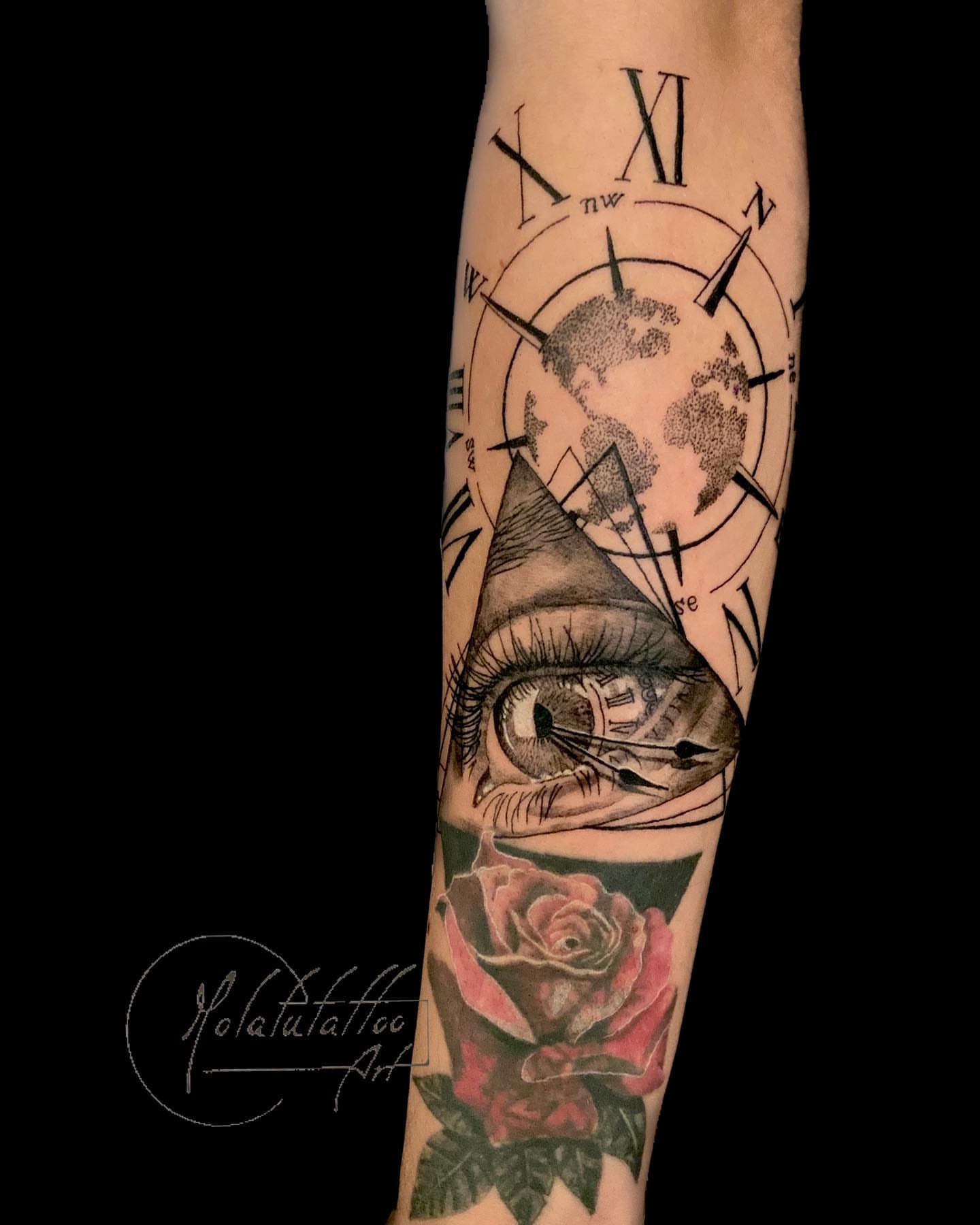Eye and pyramid geometric tattoo on the forearm by Molatutattoo