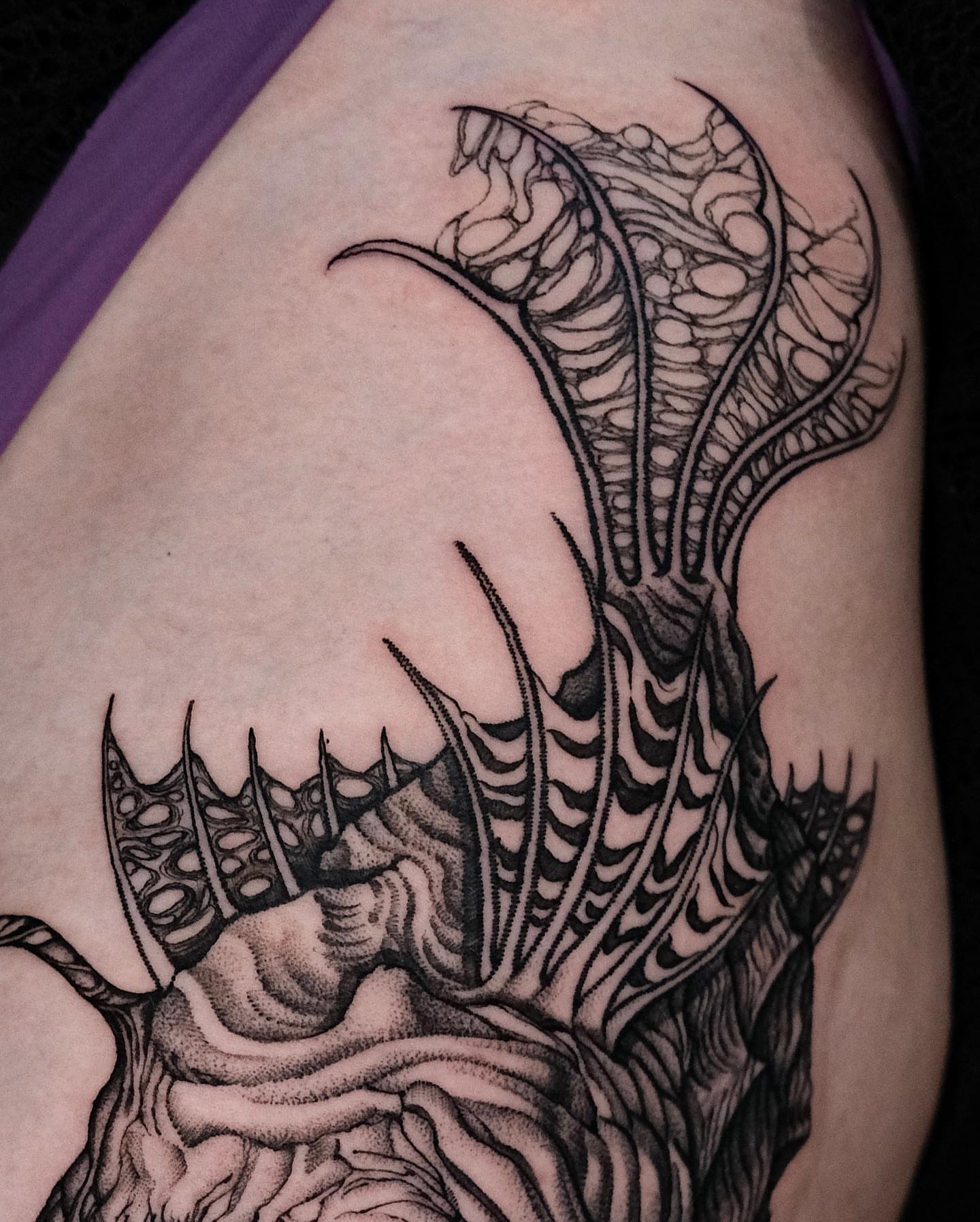 Abstract creature geometric tattoo on the thigh by Monkey Bob Tattoo