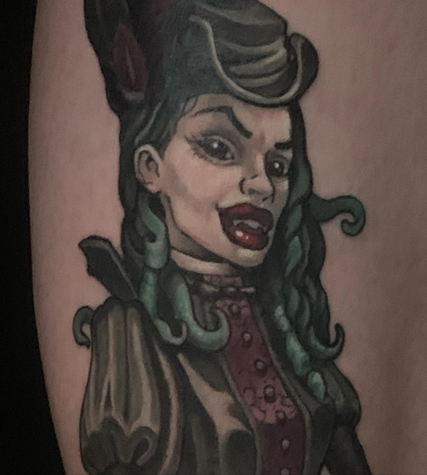 Vampire woman American traditional tattoo on the forearm by shane baker