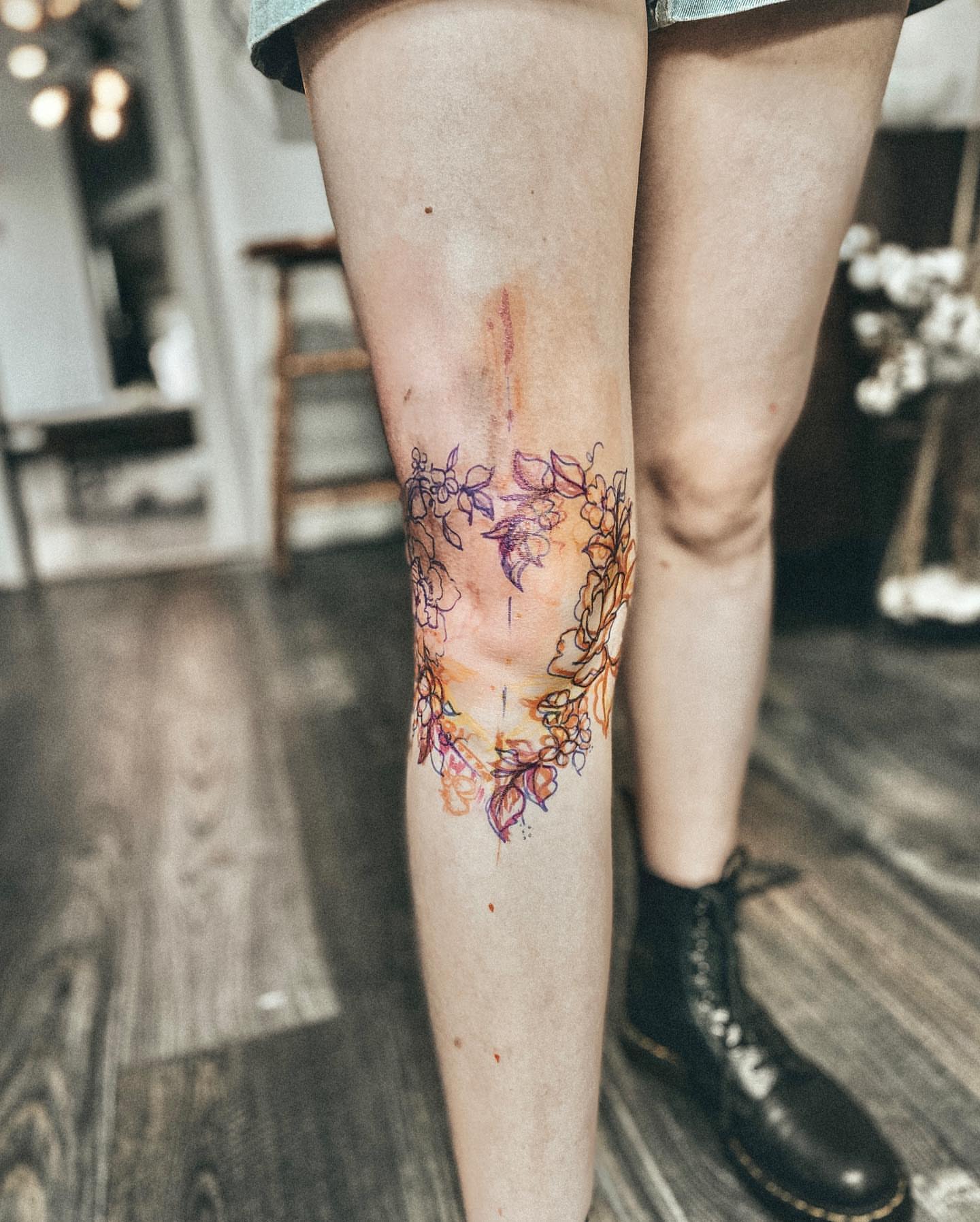 Watercolor floral design watercolor tattoo on the calf by Ayauna Mai