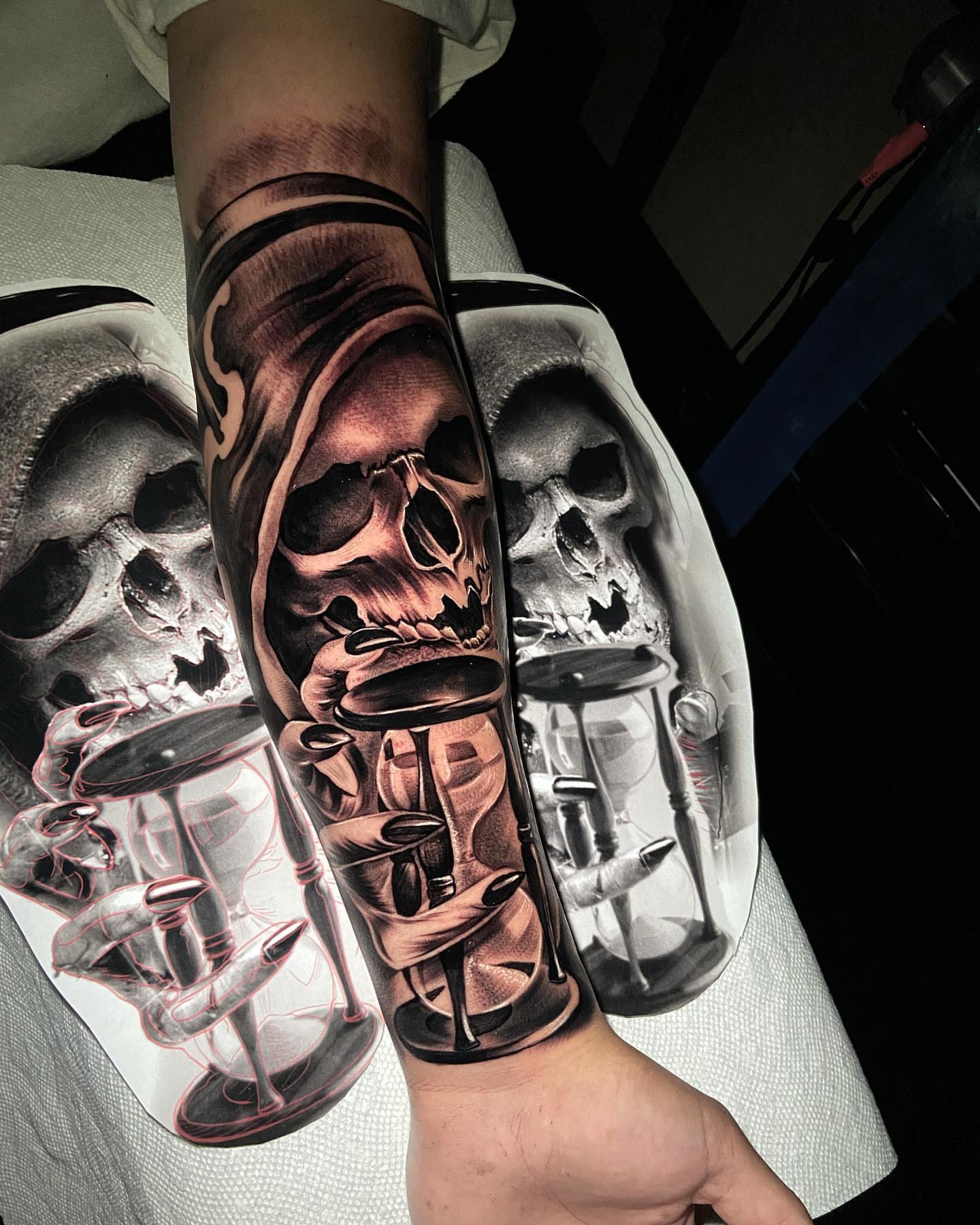 Hourglass and skulls realism tattoo on the forearm by eksoe_