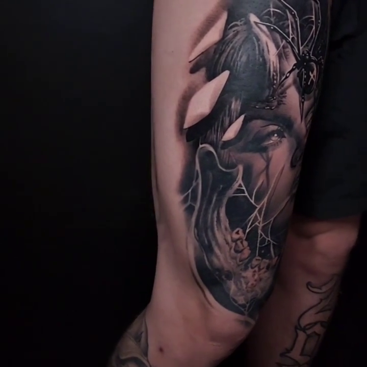 Woman with spider dark realism tattoo by Nathan Mathers Tattooist