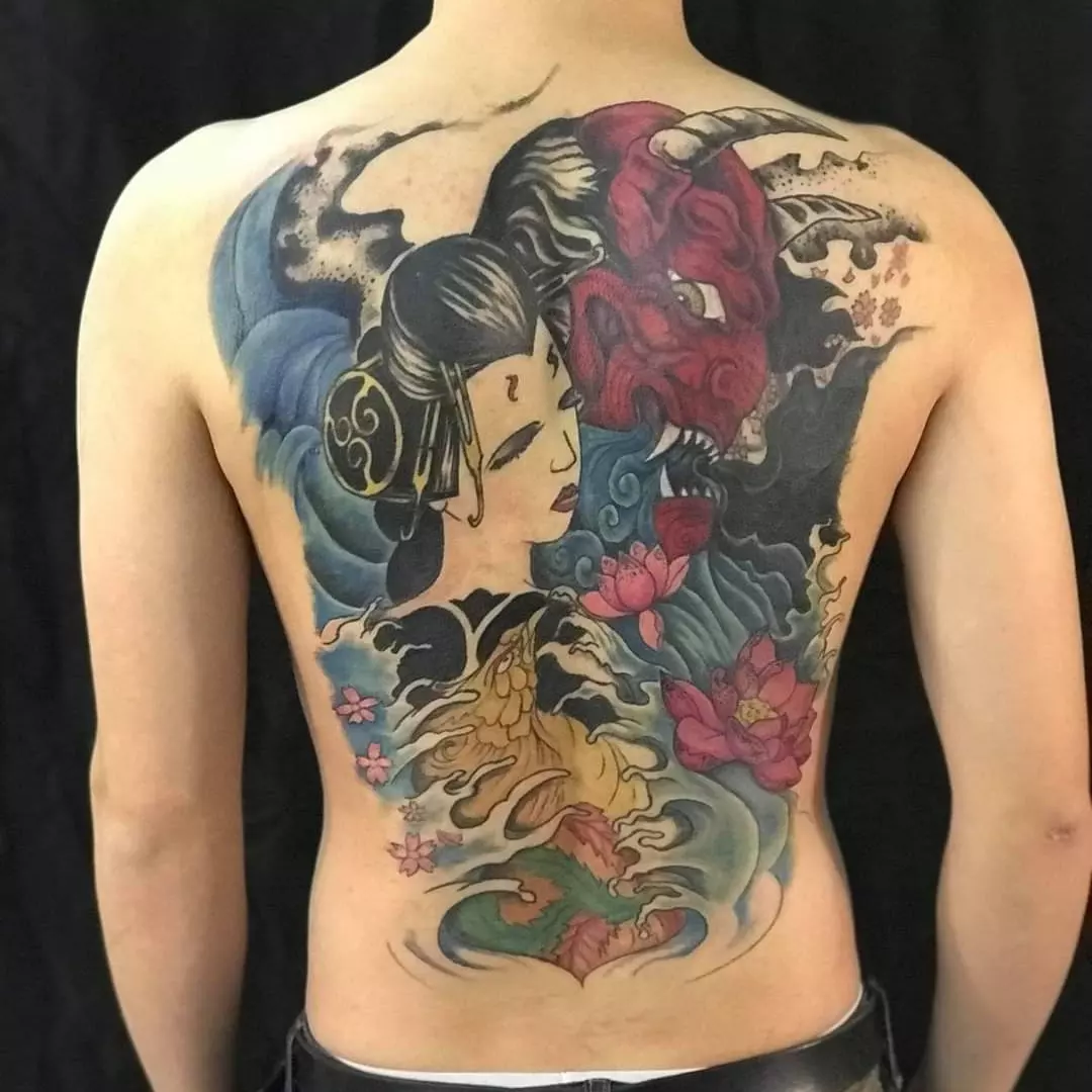 Geisha and oni mask with waves Japanese tattoo on the back by Russell Lucas
