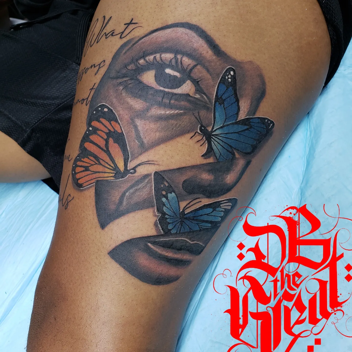 Eye and butterflies realism tattoo on the thigh by Dannie Blythewood