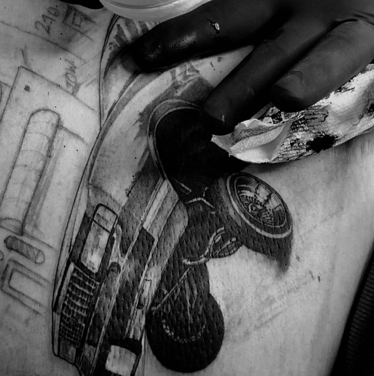 Boombox black and grey tattoo on the forearm by Justin Hendrick