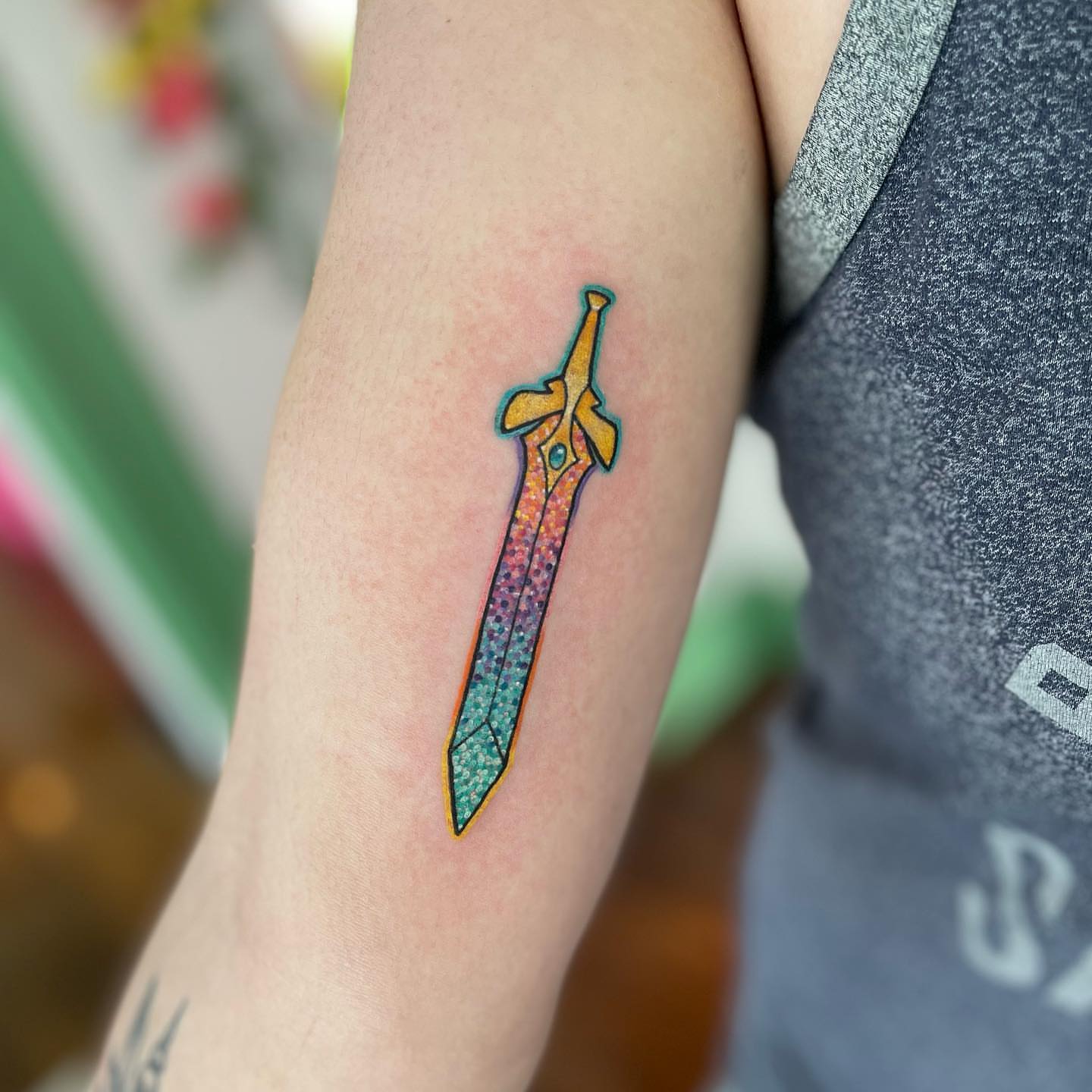 Sword dotwork tattoo on the forearm by Erin Miller
