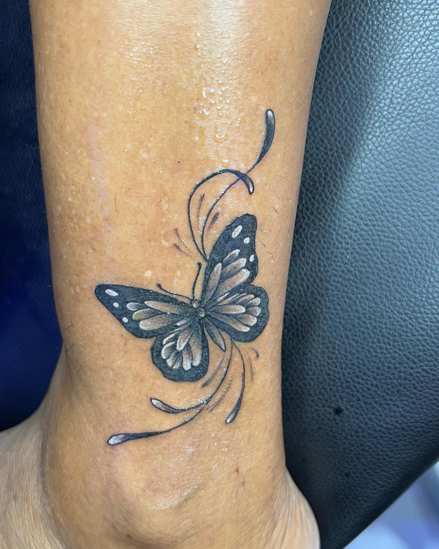 Butterfly black and grey tattoo on the forearm by oxideTattoo, Morne-à-l'Eau
