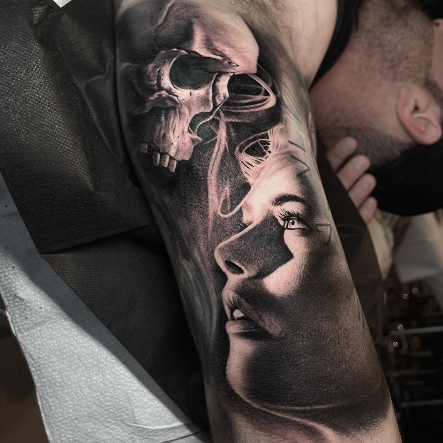 Skull and woman realism tattoo on the forearm by Martin Reyes Jr