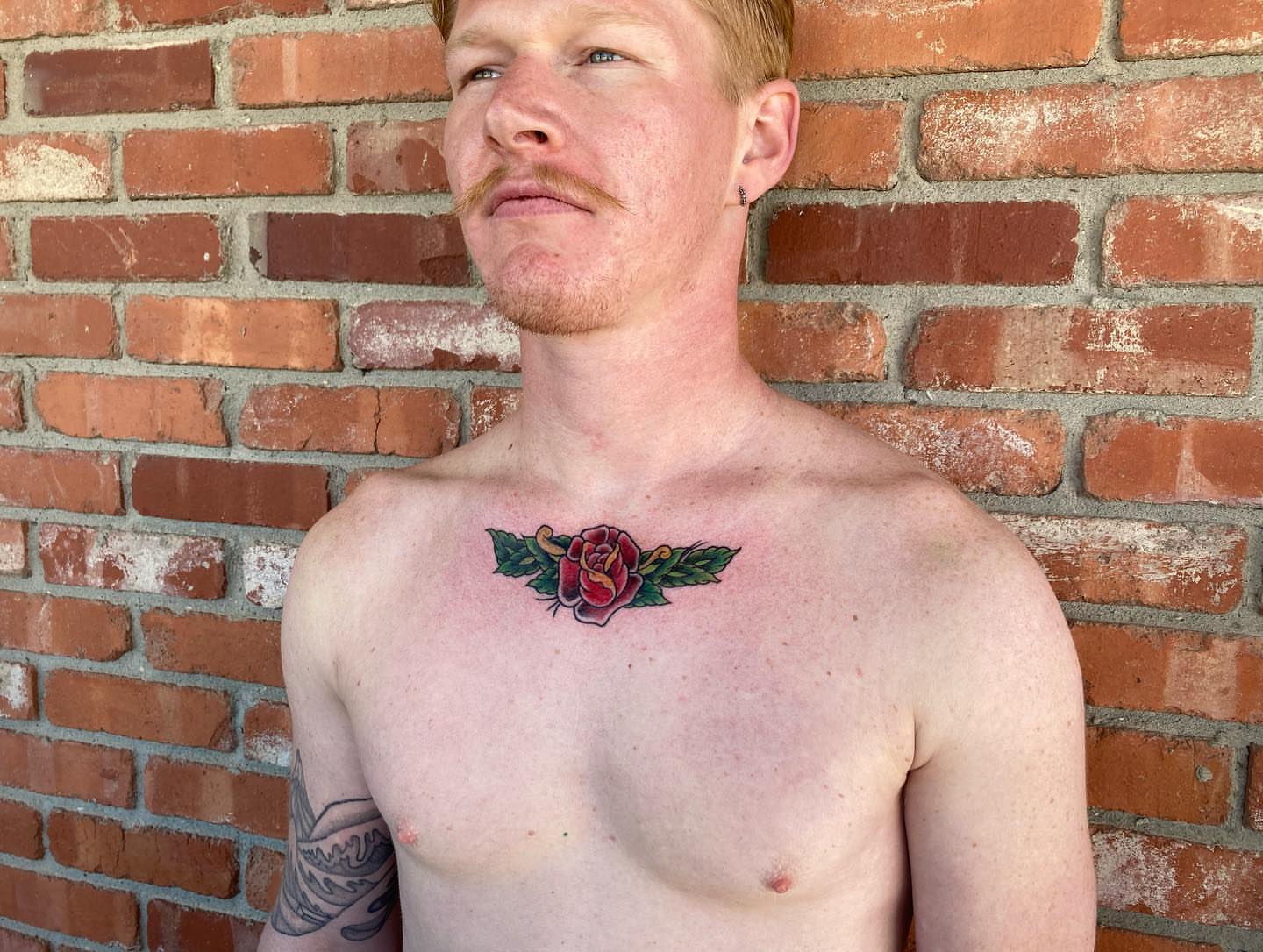 Rose American traditional tattoo on the chest by Chuck House