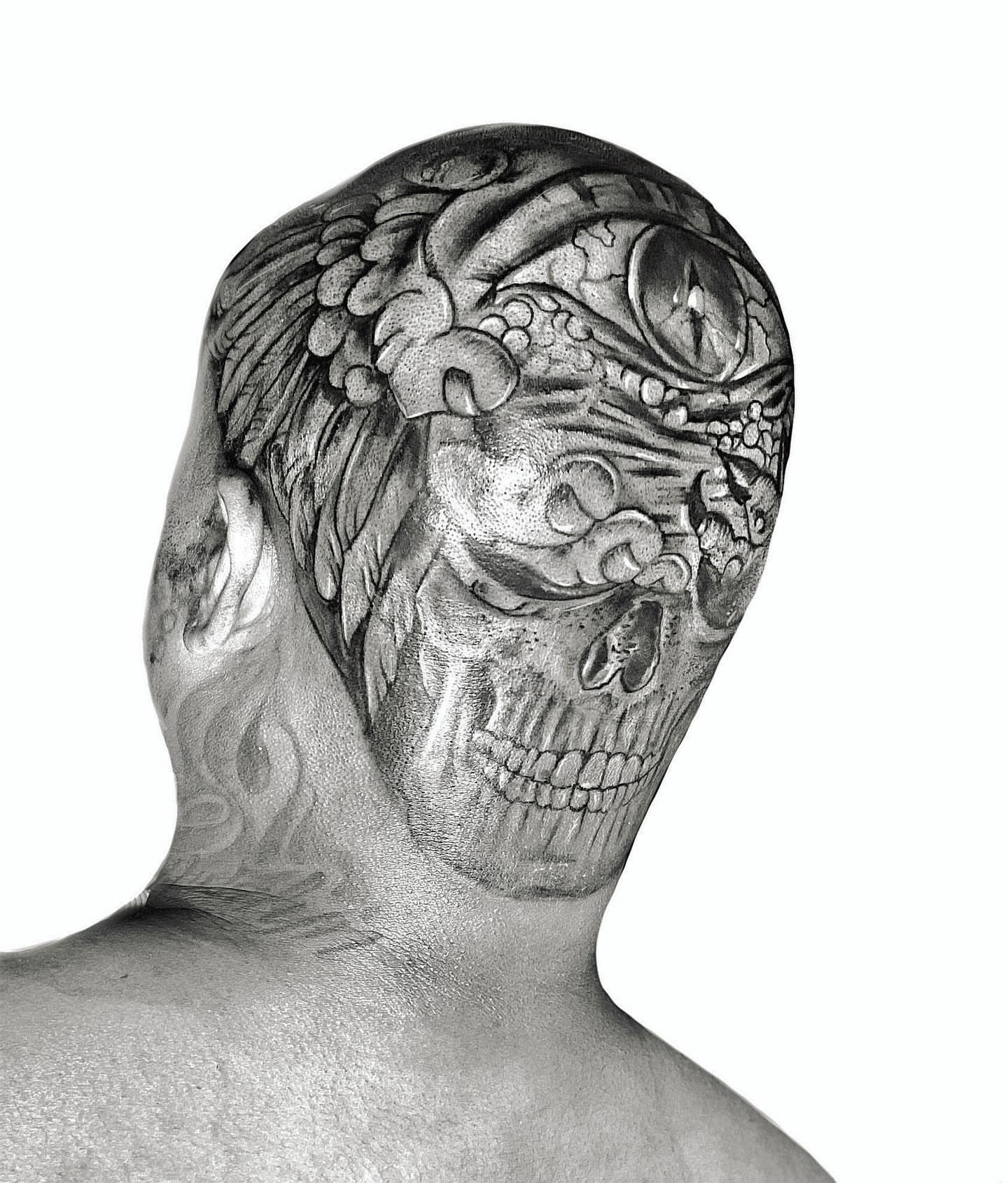 Skull with wings realism tattoo on the head by Ken West