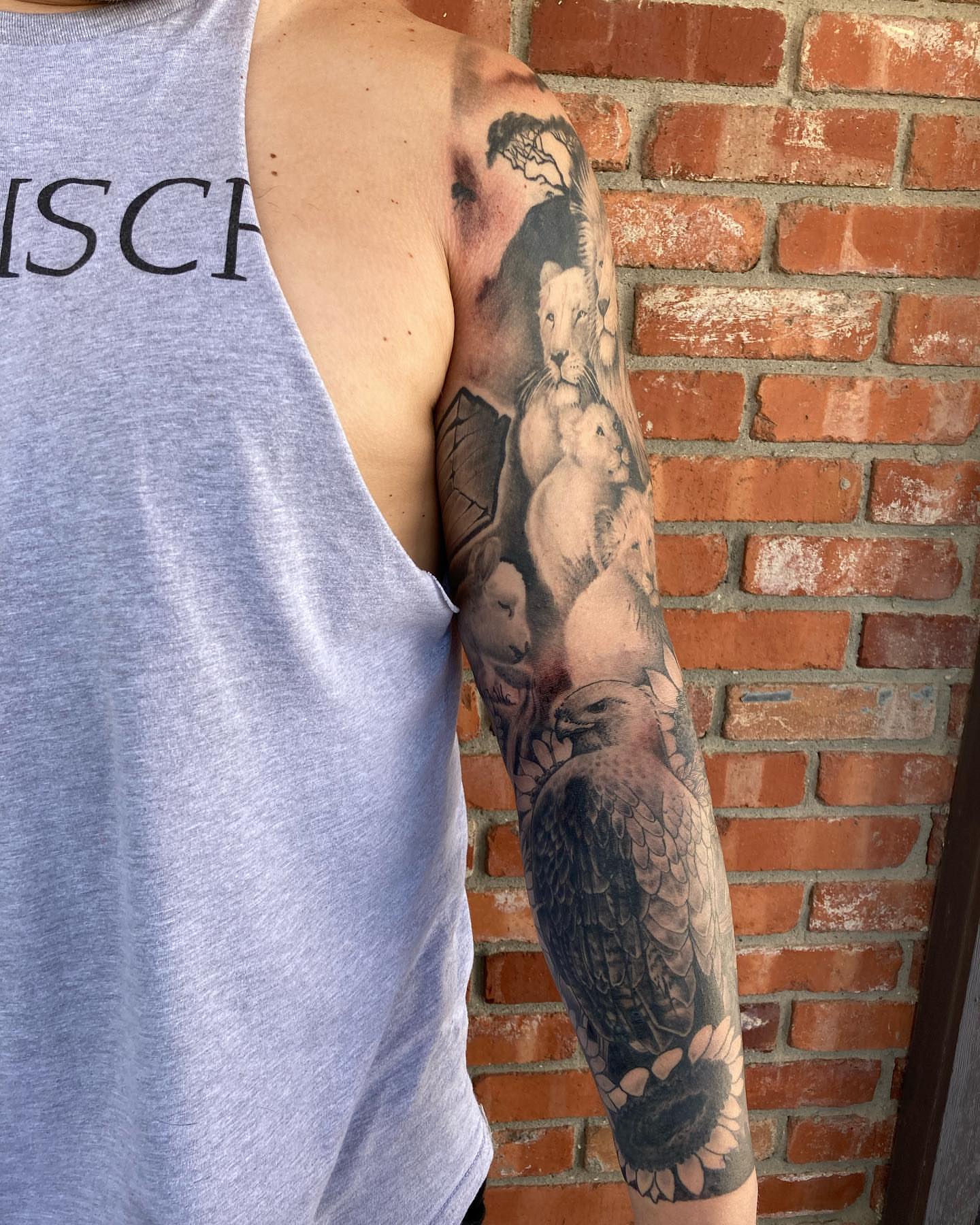 Animal family realism tattoo on the forearm by Chuck House