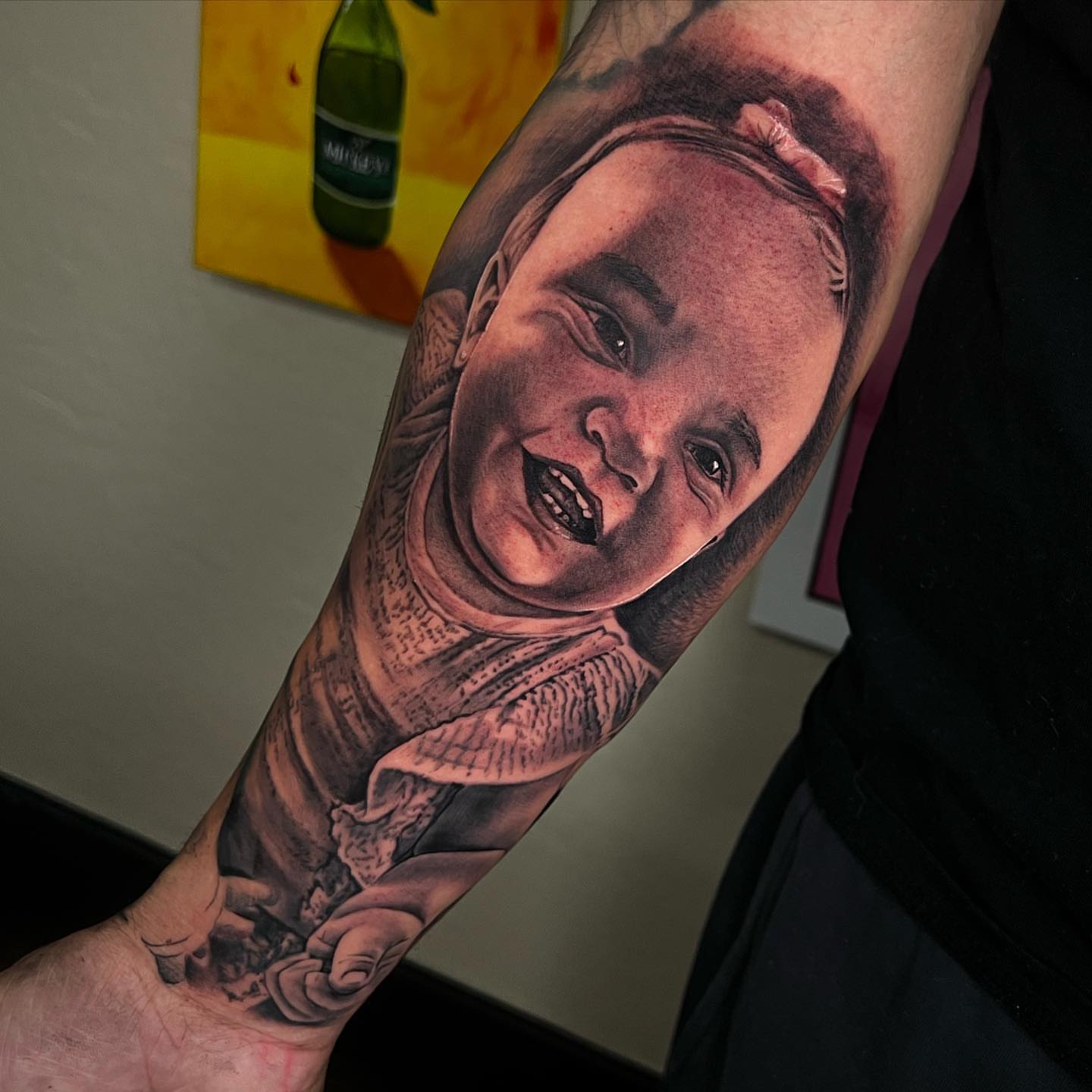 Portrait realism tattoo on the forearm by Angel Lizarraga