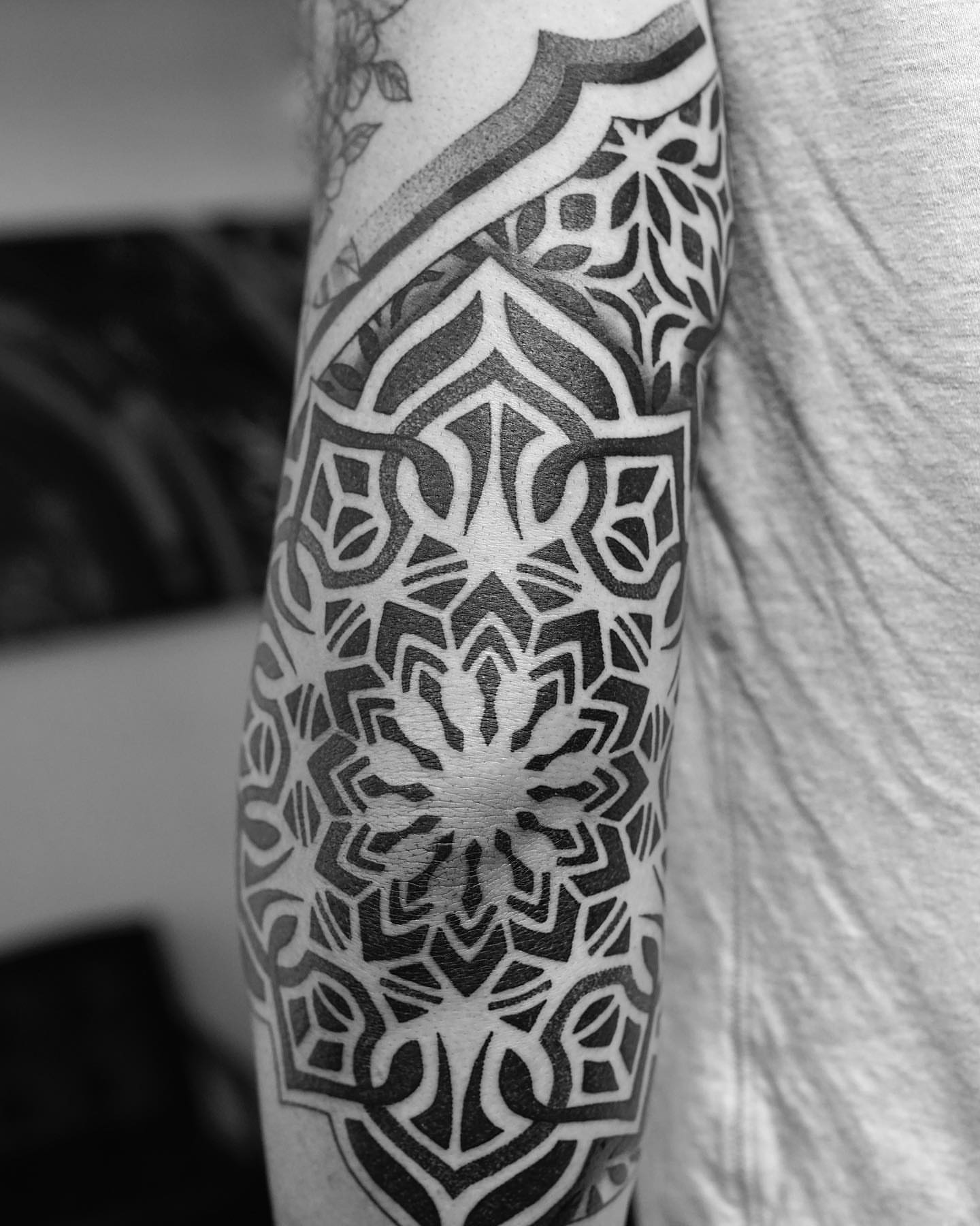 Geometric pattern geometric tattoo on the forearm by Ross Krandel
