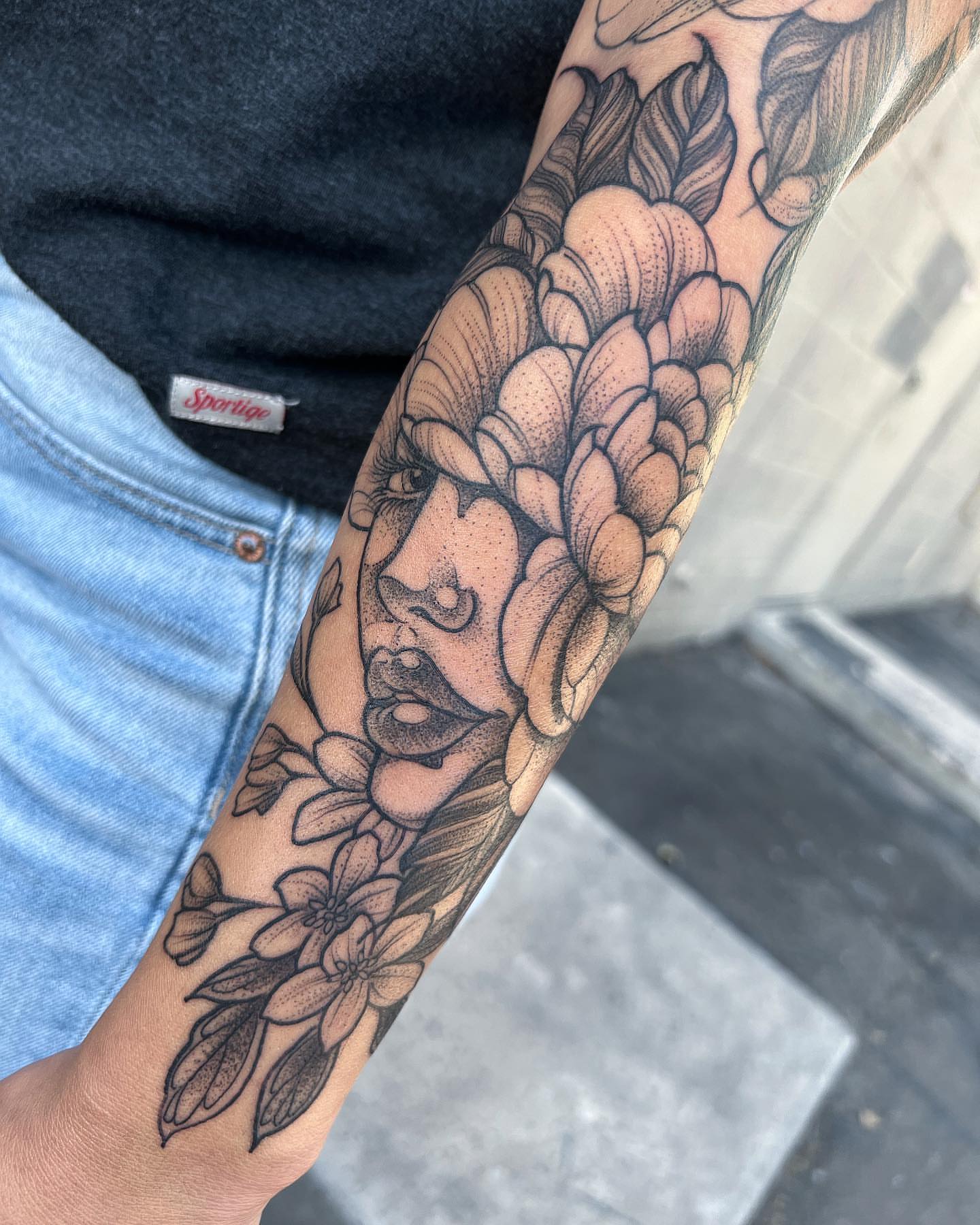 Floral portrait realism tattoo on the forearm by Byron Winkelman, Gilbert, Arizona