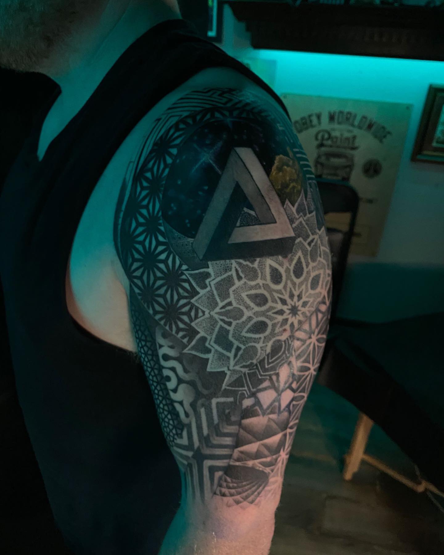 Geometric mandala dotwork tattoo on the forearm by Dustin Lane Collins