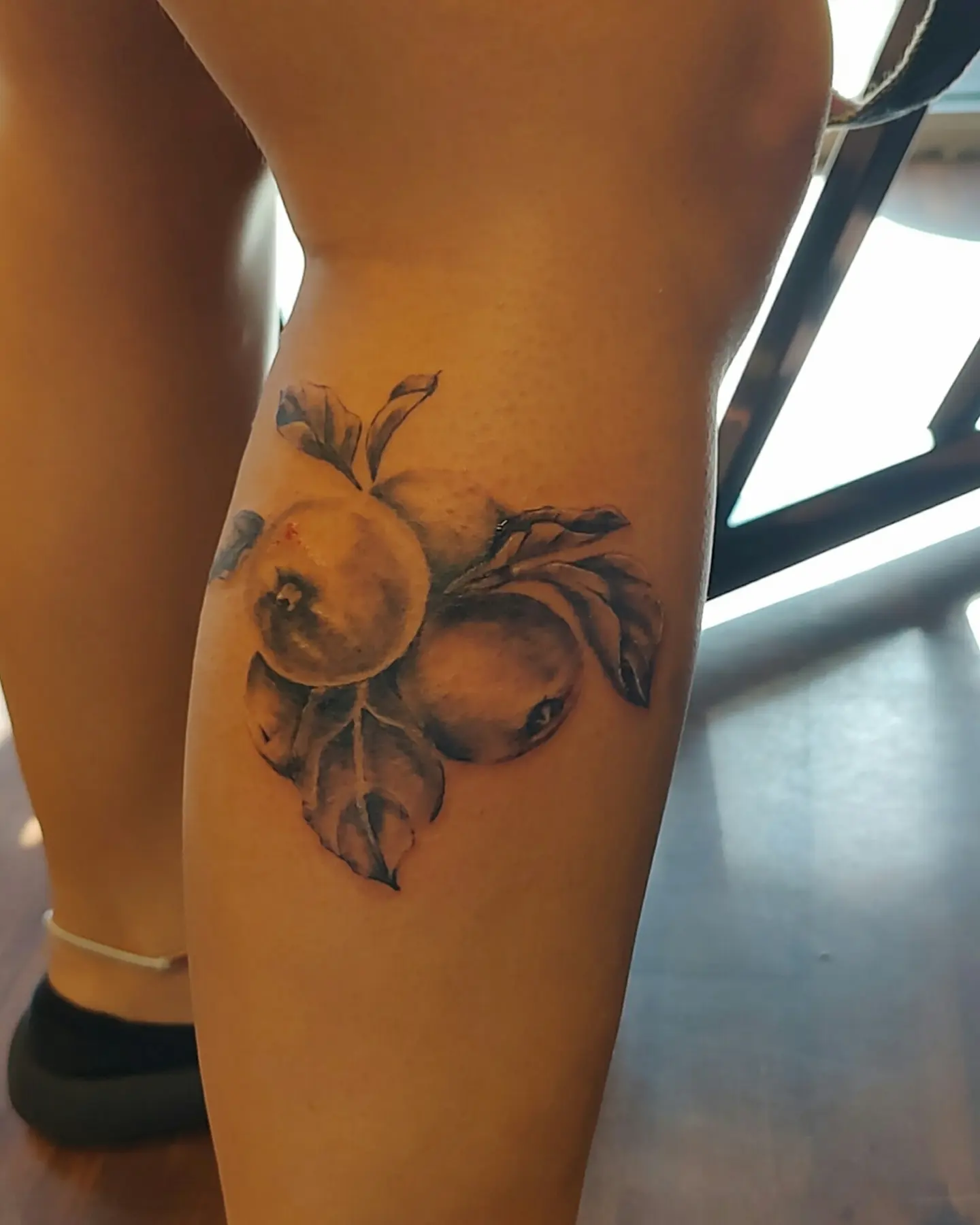 Fruit bunch realism tattoo on the calf by Madelynne