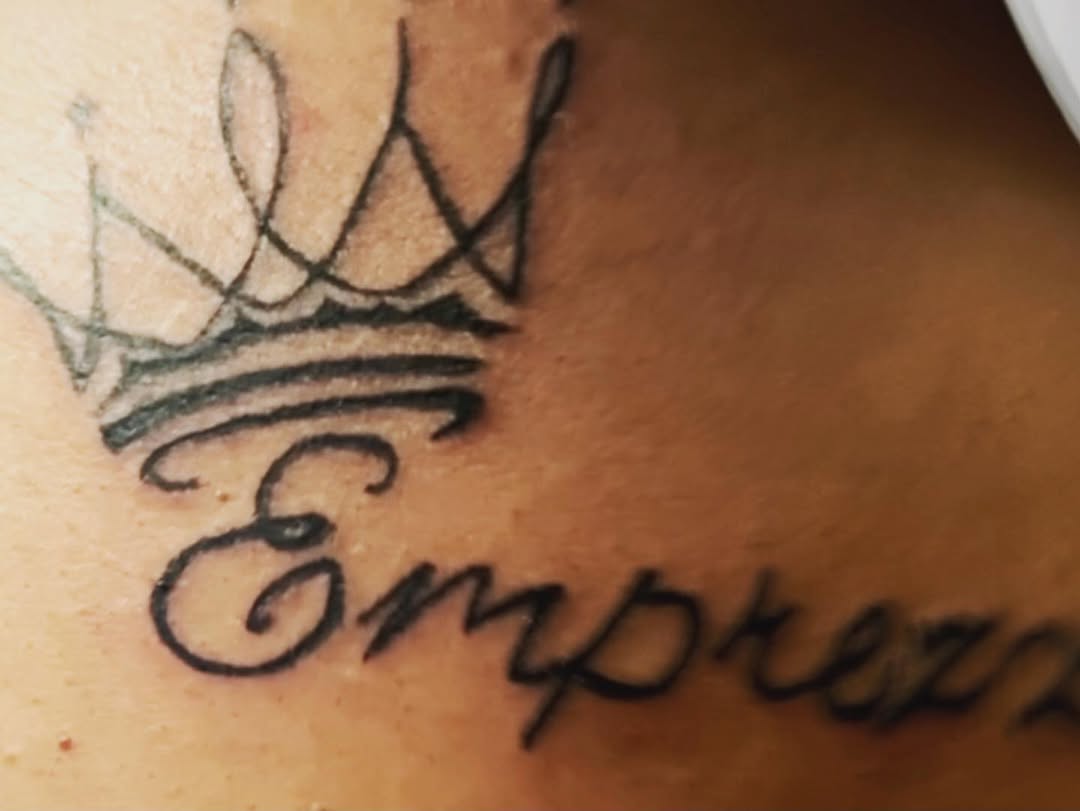 Crown and lettering tattoo on the shoulder by Danimals