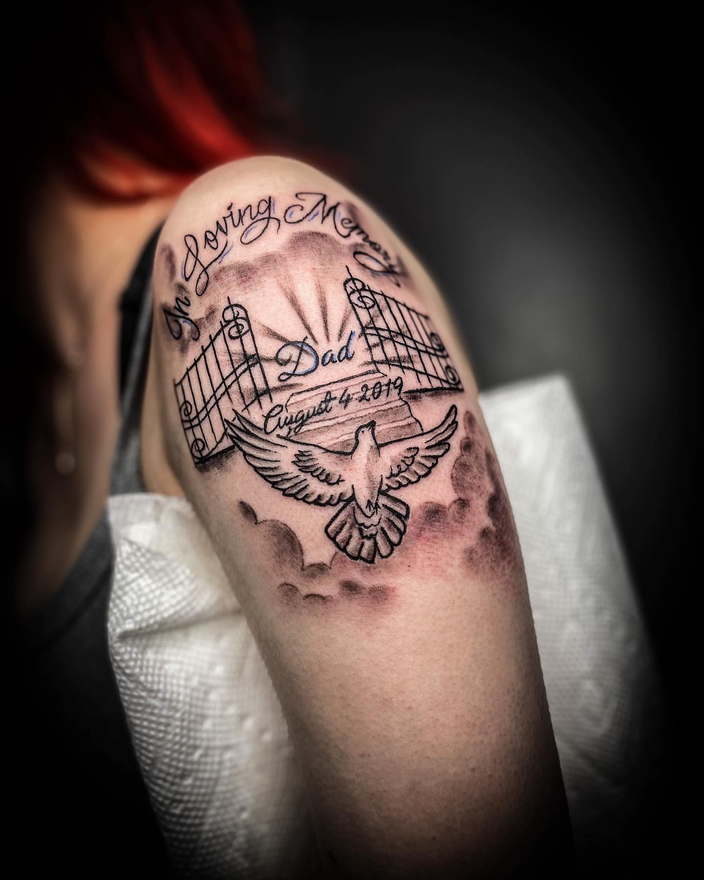 Dove and gate black and grey tattoo on the forearm by Traveling Tattoo Artist π