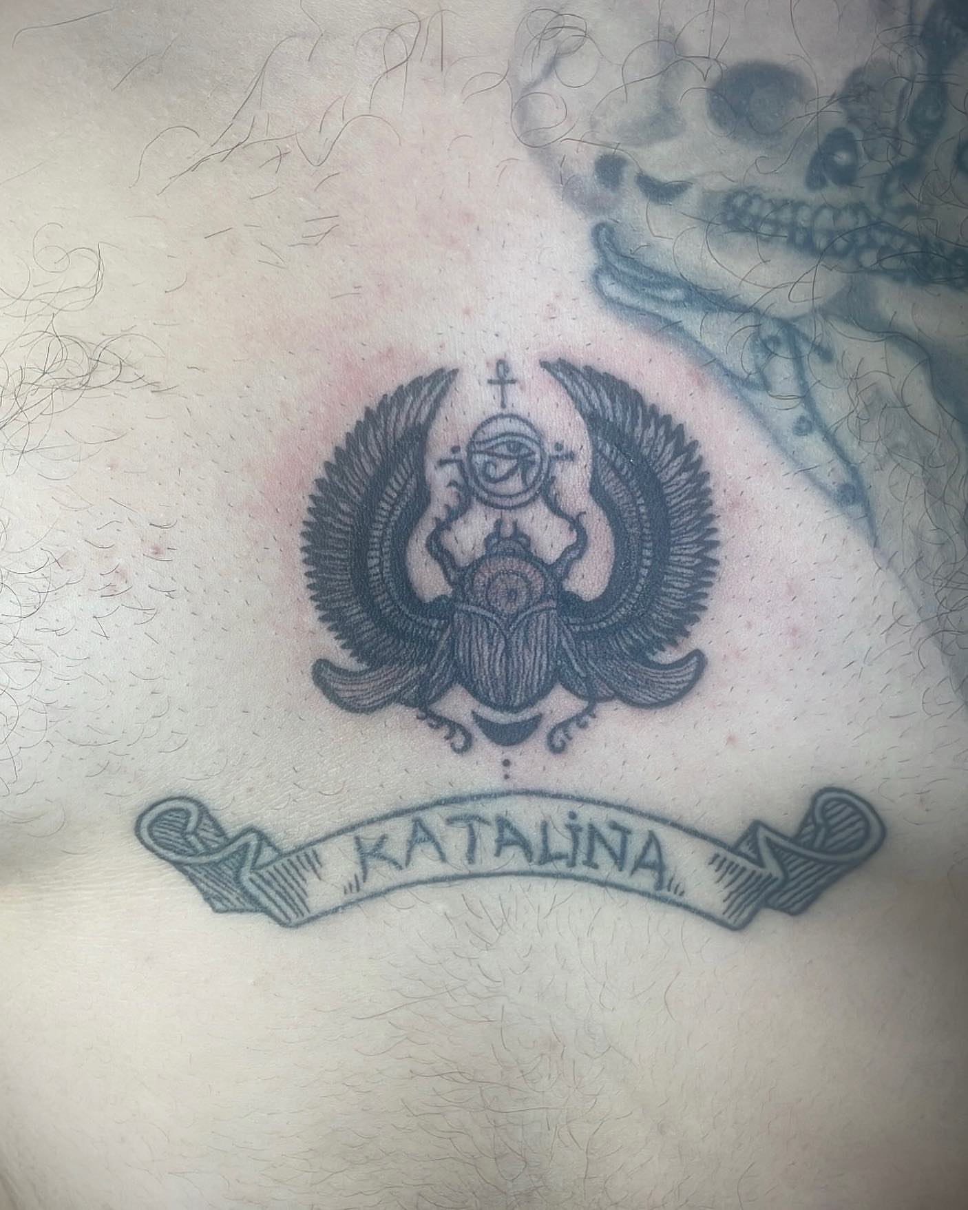 Scarab beetle black and grey tattoo on the chest by Christhian King