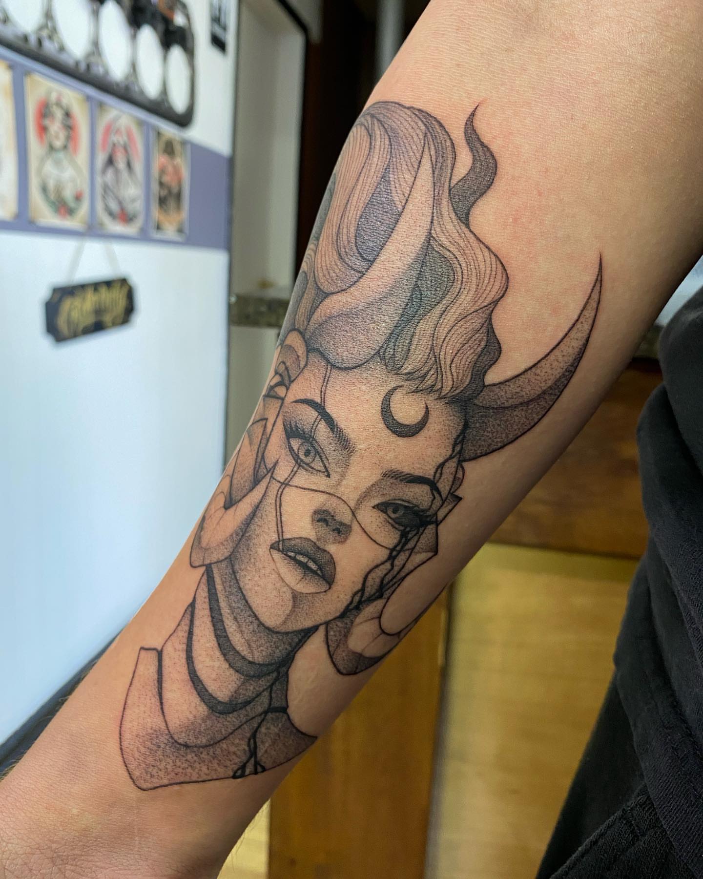 Woman's face dotwork tattoo on the forearm by seattle tattoo artist