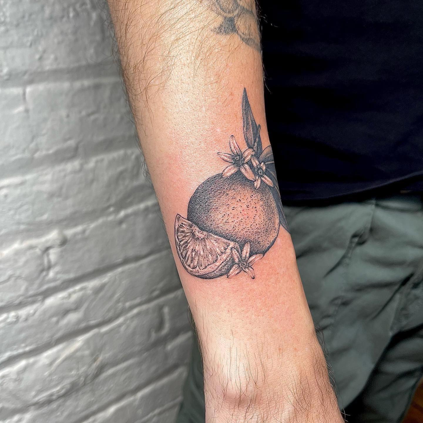 Orange slice dotwork tattoo on the forearm by 𓆏 Alyssa Carbonara 𓆏
