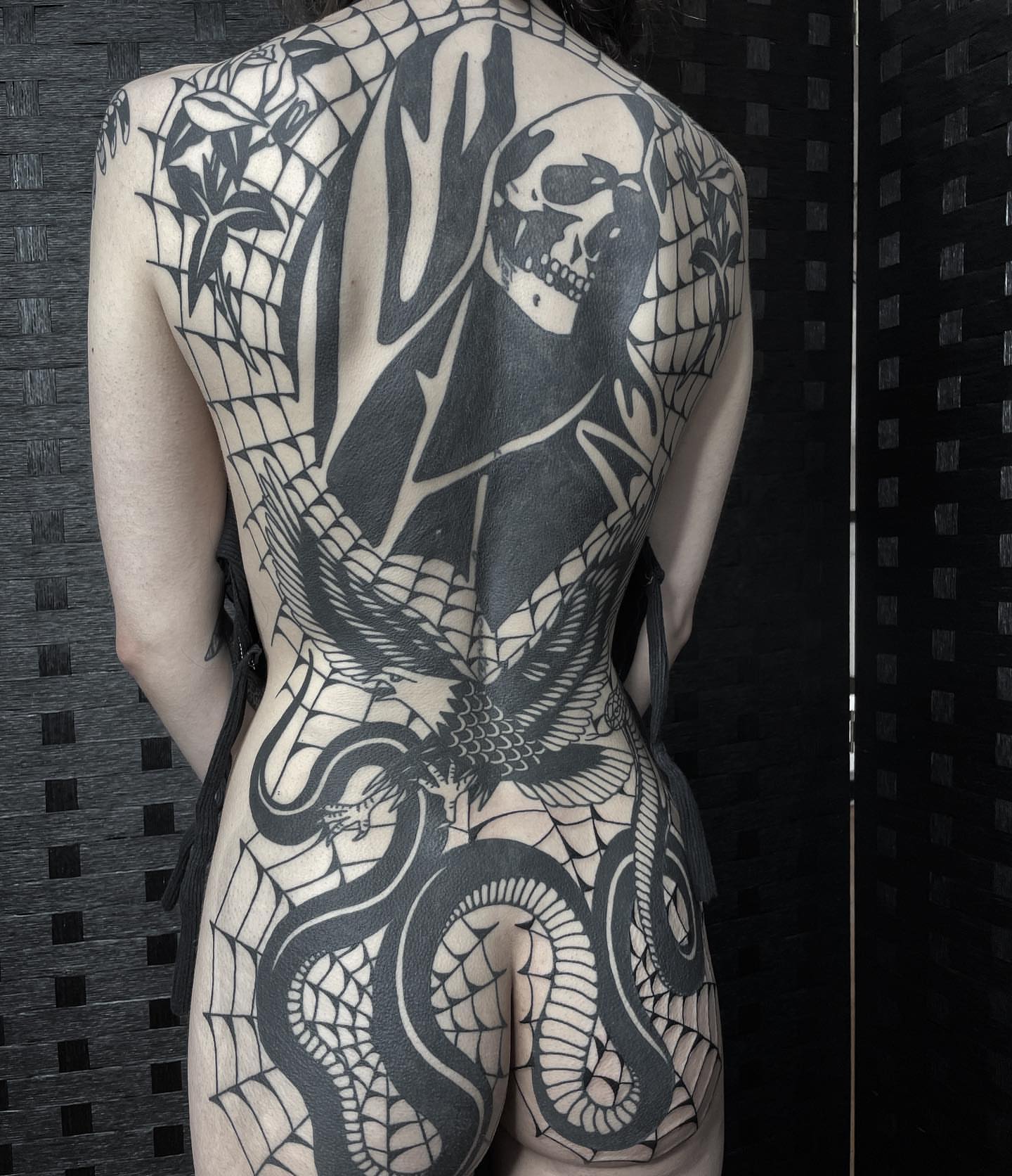Snake and skull geometric tattoo on the back by Han shinko, Portland, Oregon