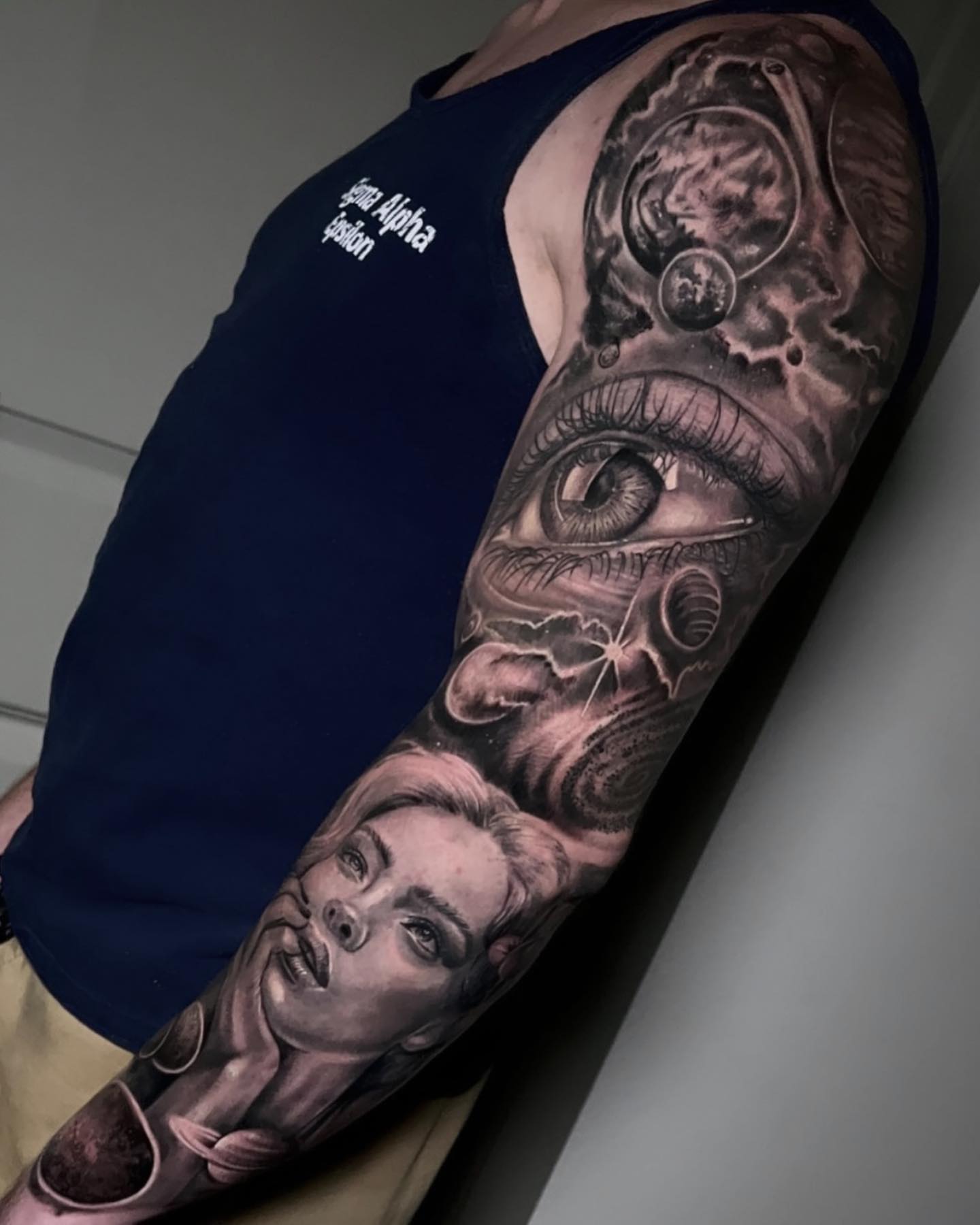 Eye and woman's face realism tattoo on the forearm by Henrry Bravo