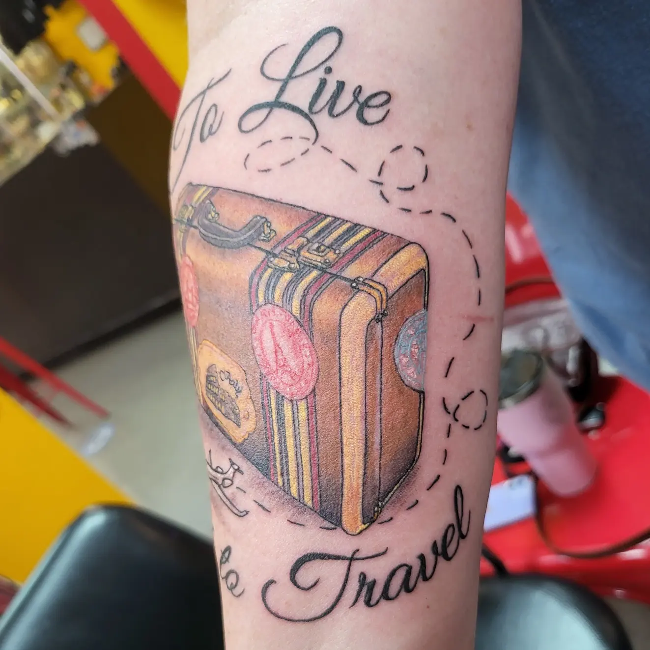 Suitcase realism tattoo on the forearm by Mike Stamper