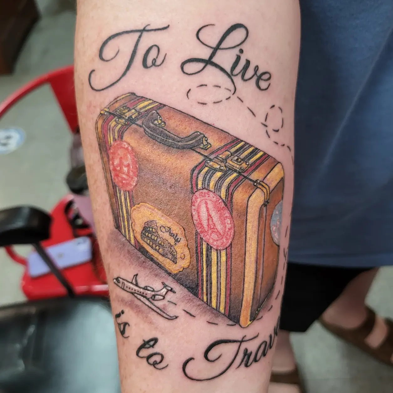 Suitcase realism tattoo on the forearm by Mike Stamper