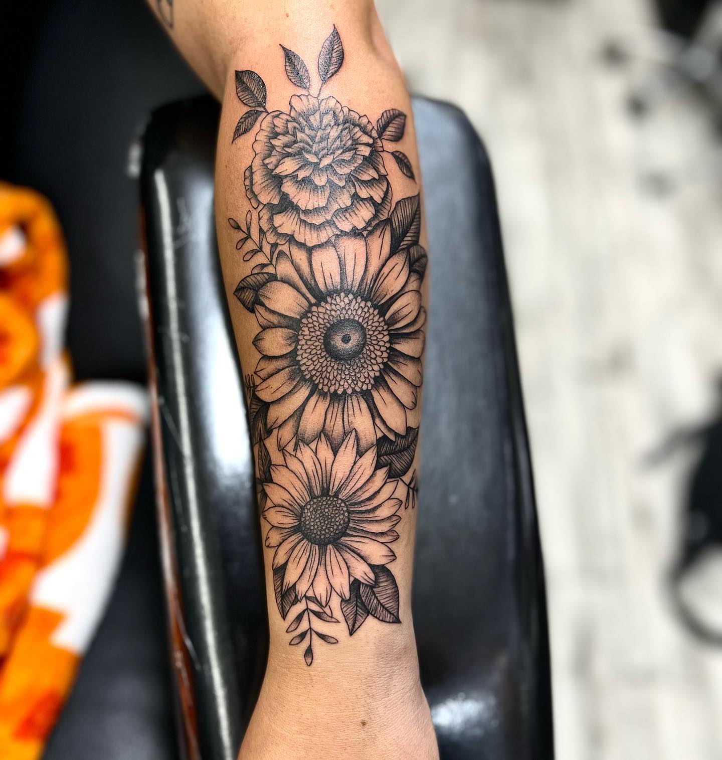 Sunflowers black and grey tattoo on the forearm by Monique Ortiz, Mesa, Arizona