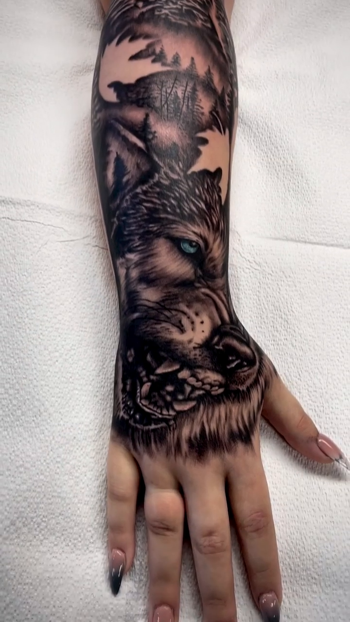 Wolf and forest landscape realism tattoo by Charlie