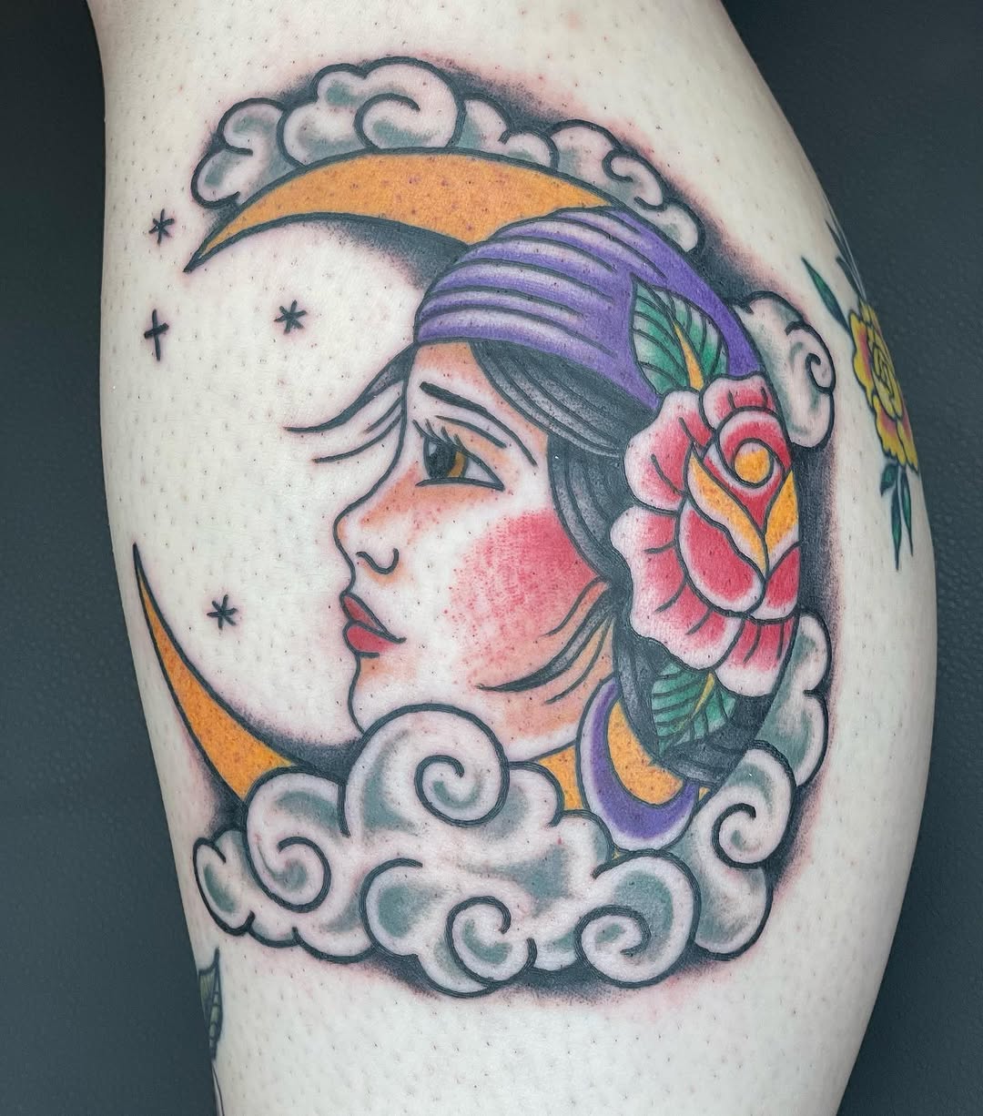 Woman on moon with clouds neo-traditional tattoo on the thigh by Erin Stephens