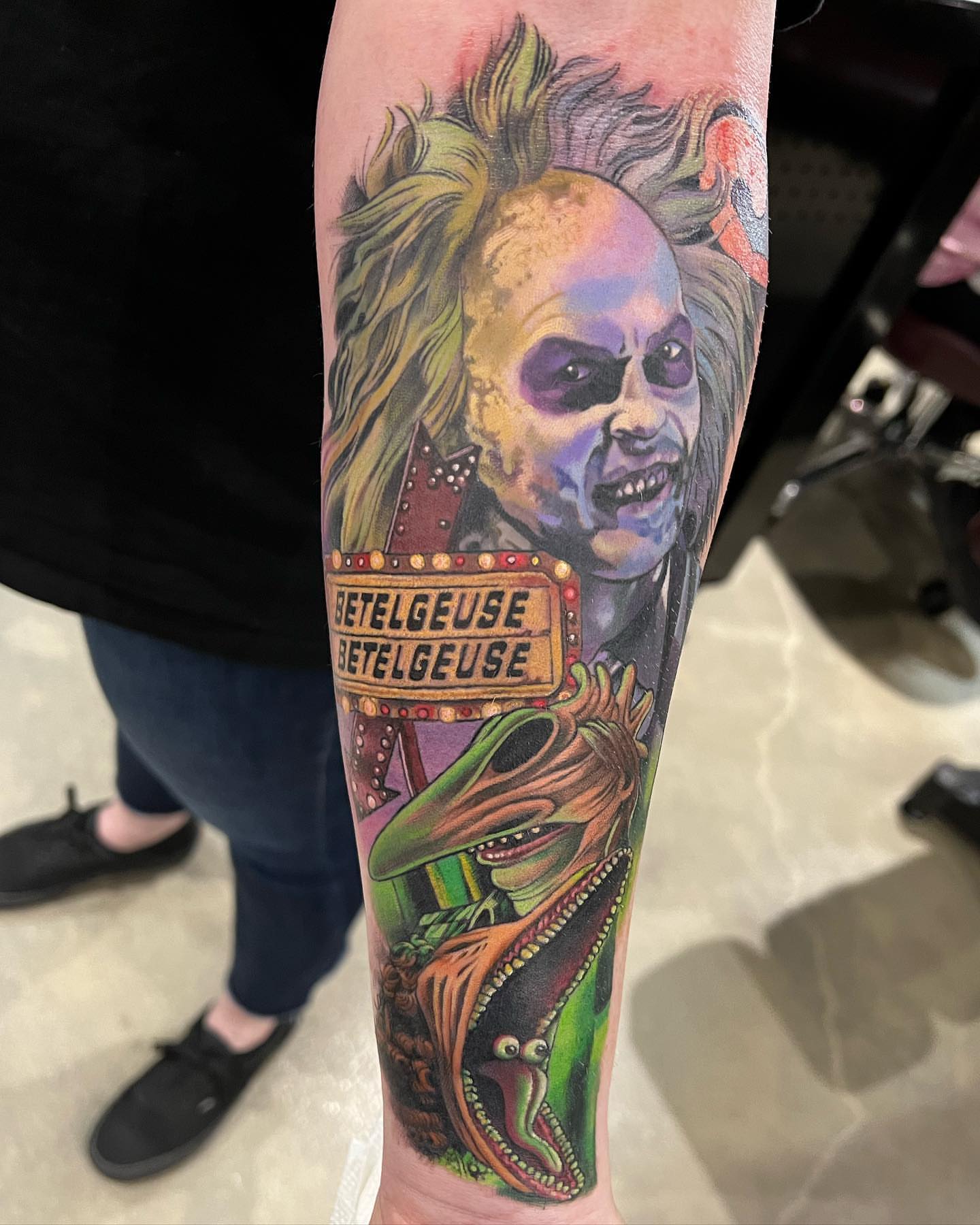 Beetlejuice realism tattoo on the forearm by Walter Frank