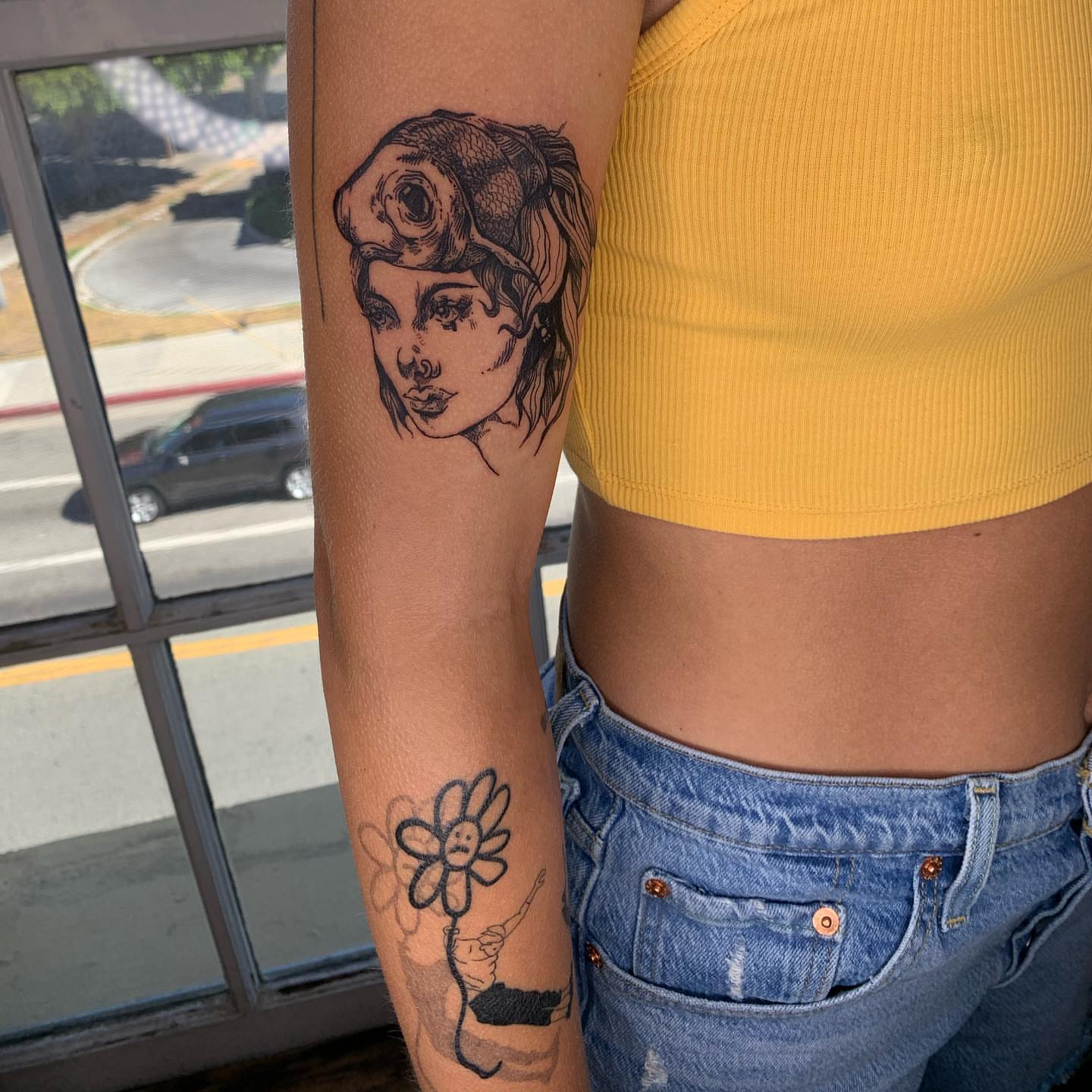 Woman with flower black and grey tattoo on the forearm by ᴀmb⃘er