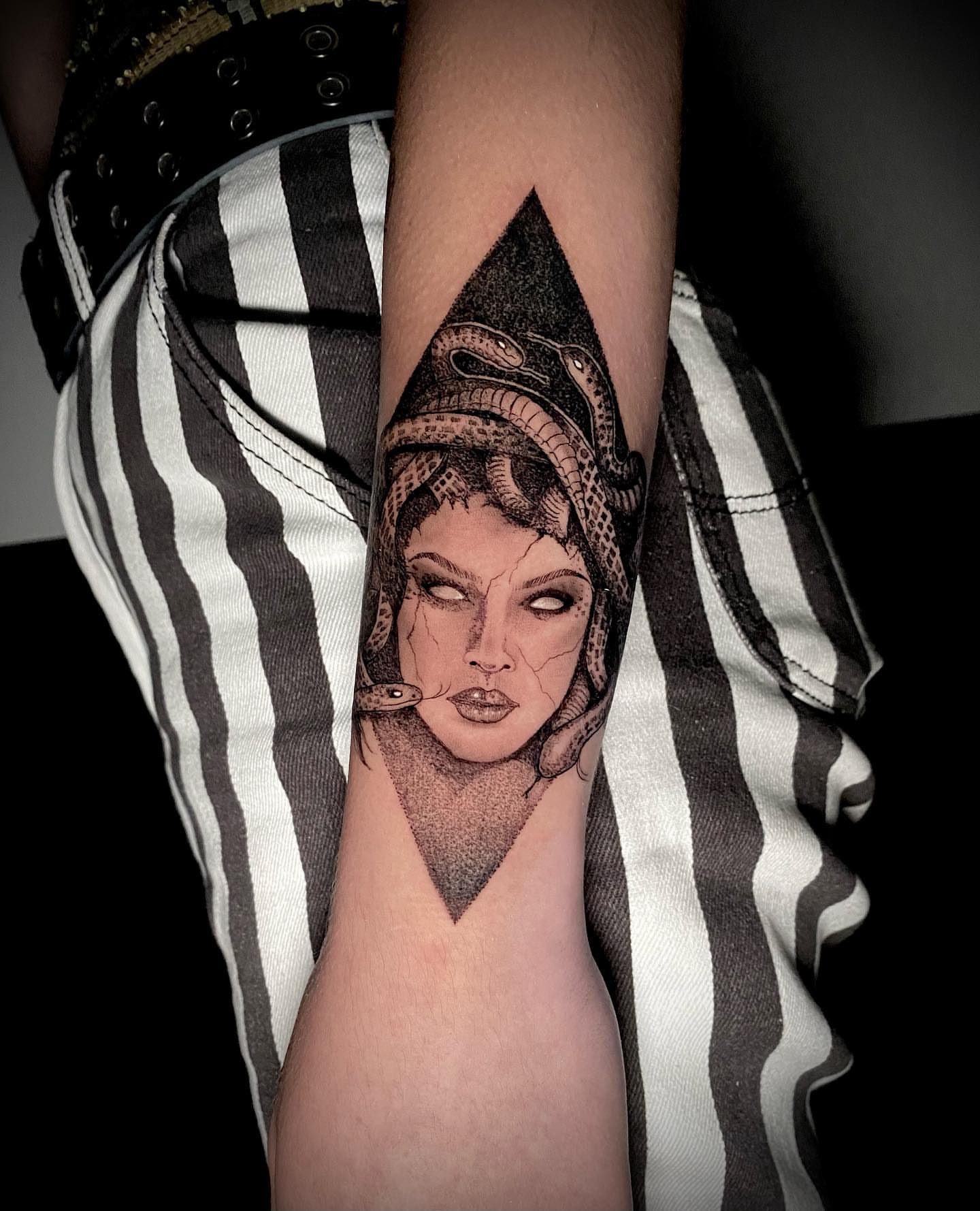 Woman with snakes dotwork tattoo on the forearm by Dayana✨