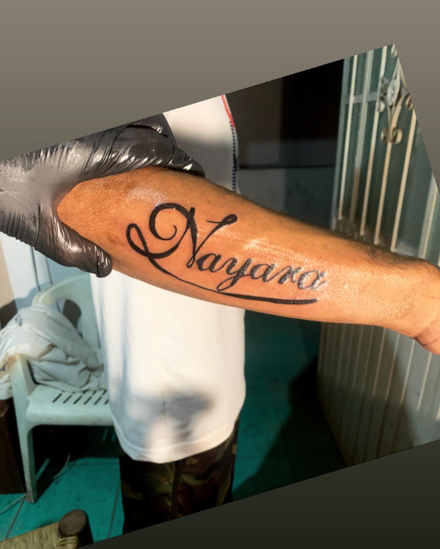 Nayara lettering script tattoo on the forearm by El Zepa