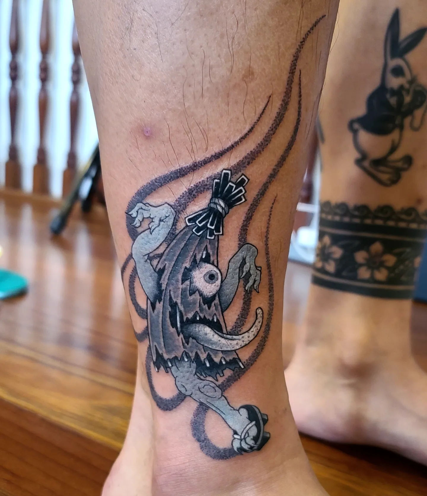Monster black and grey tattoo on the calf by 彫かか