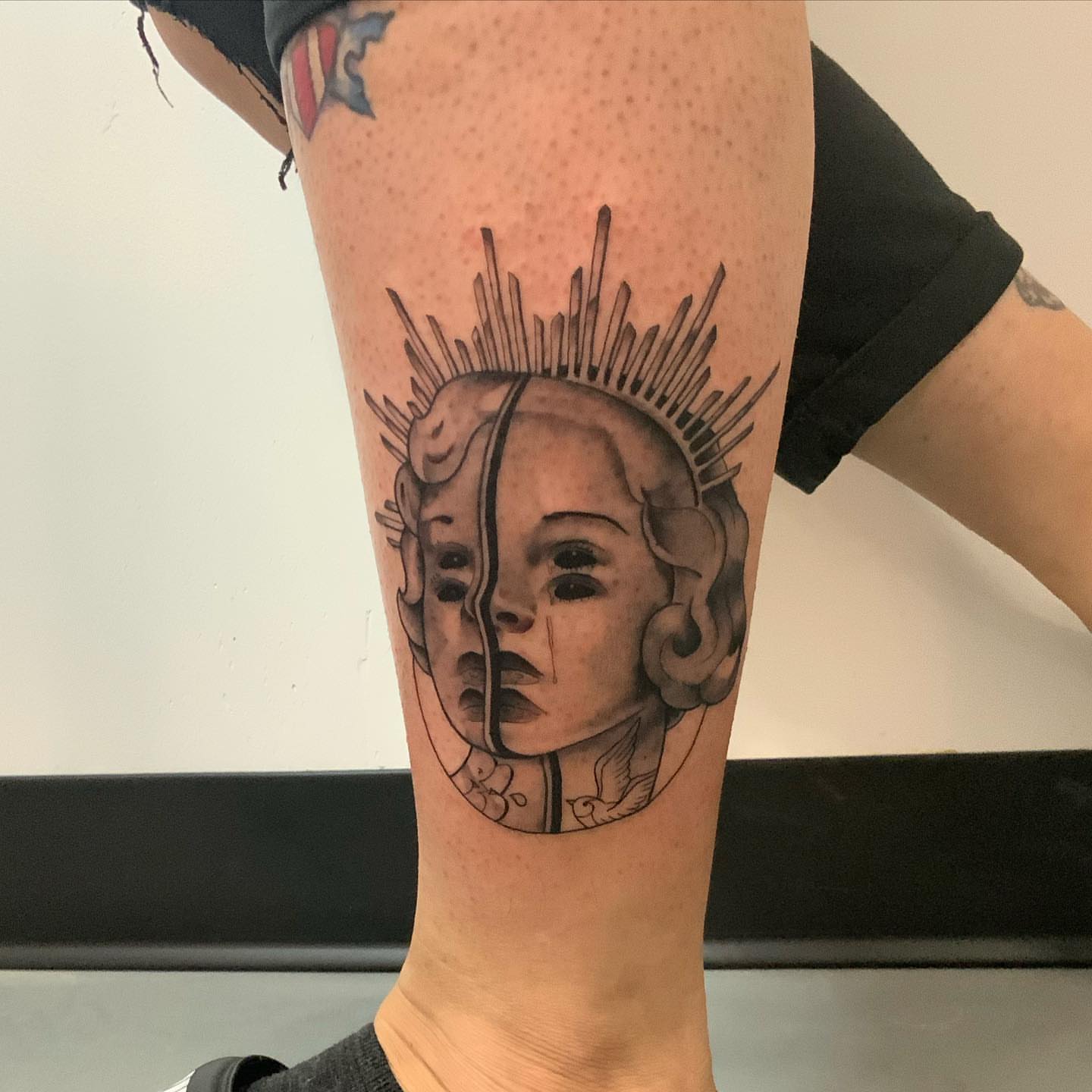 Split face realism tattoo on the forearm by Herc